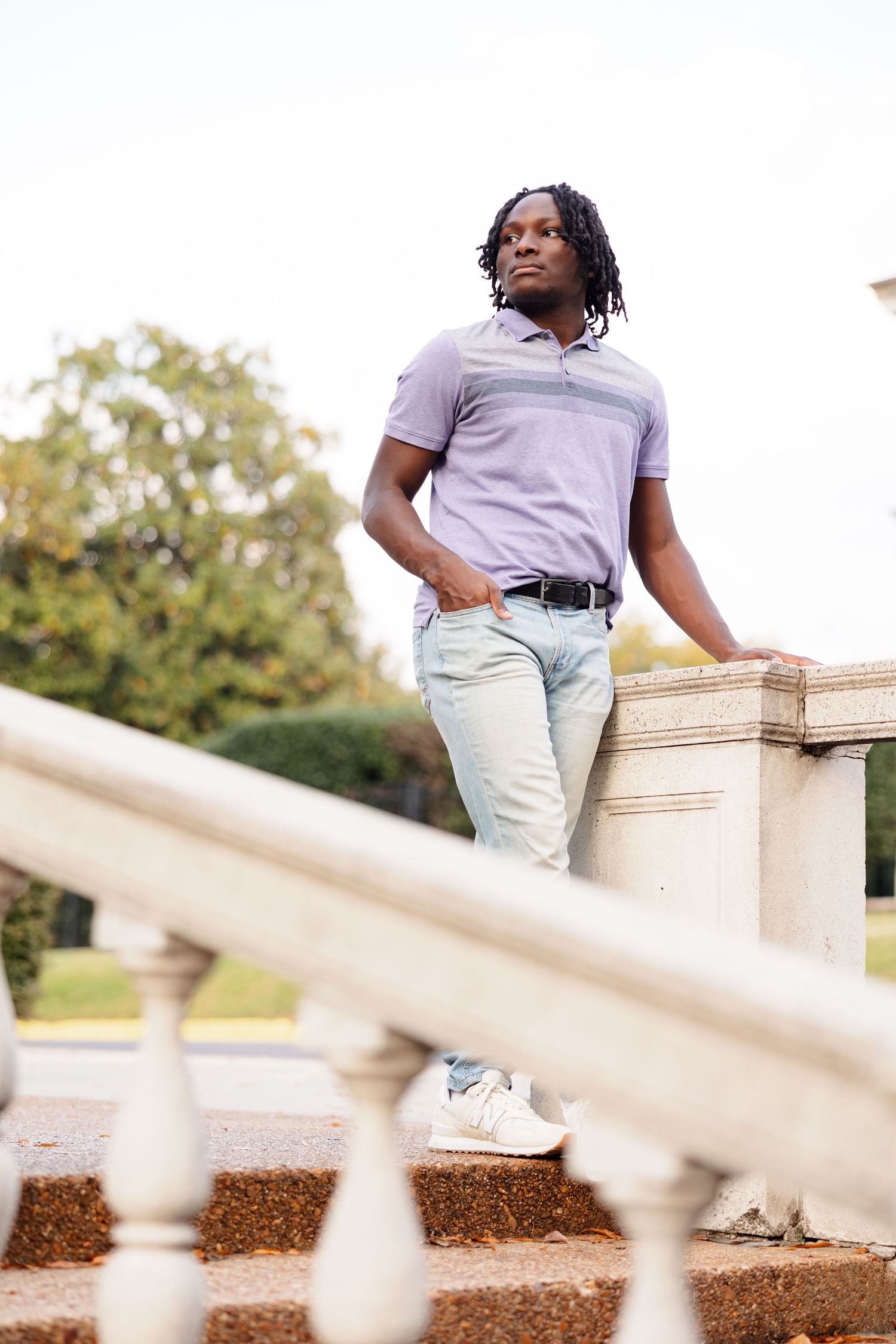 A senior boy poses for a portrait in front of the Brooks Museum in Memphis, TN.