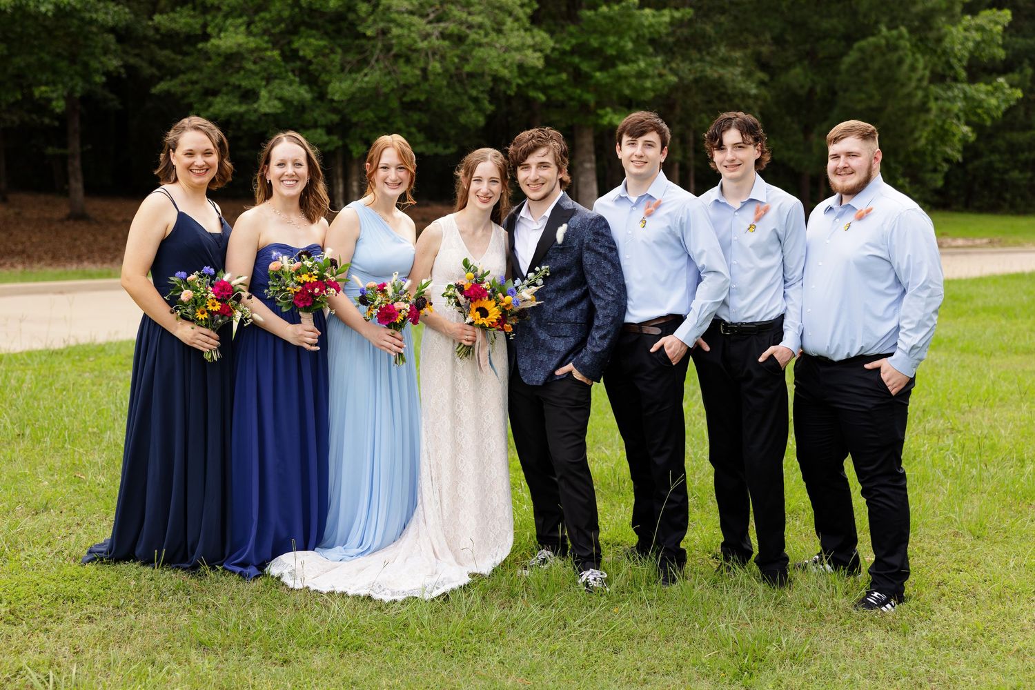 Bride and groom with bridal party for a portrait by Memphis wedding photographer Emily Joy Photography