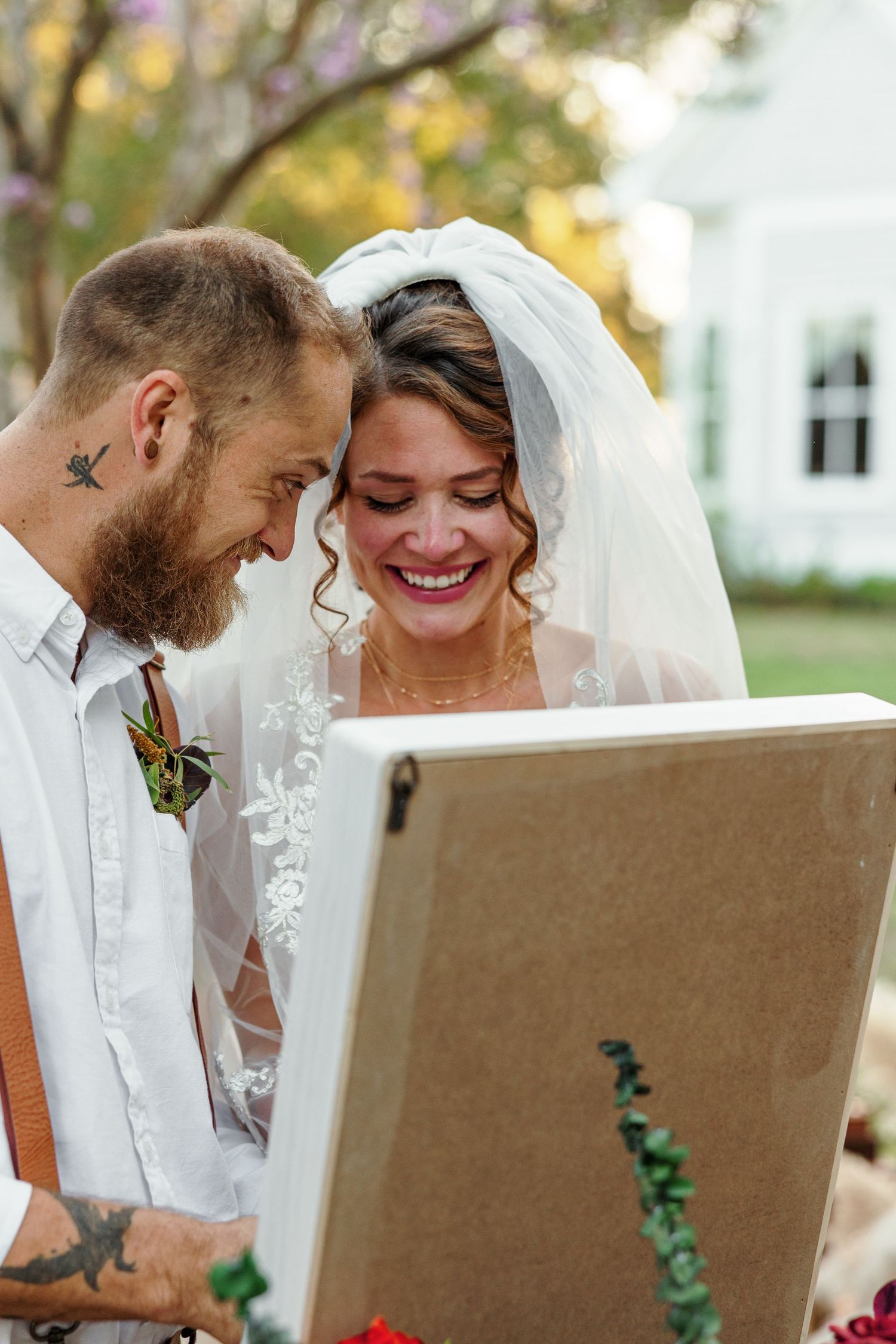 Bride and Groom tie symbolic knot during outdoor wedding photographed by Emily Joy Photography, now a wedding photographer in Memphis, TN.