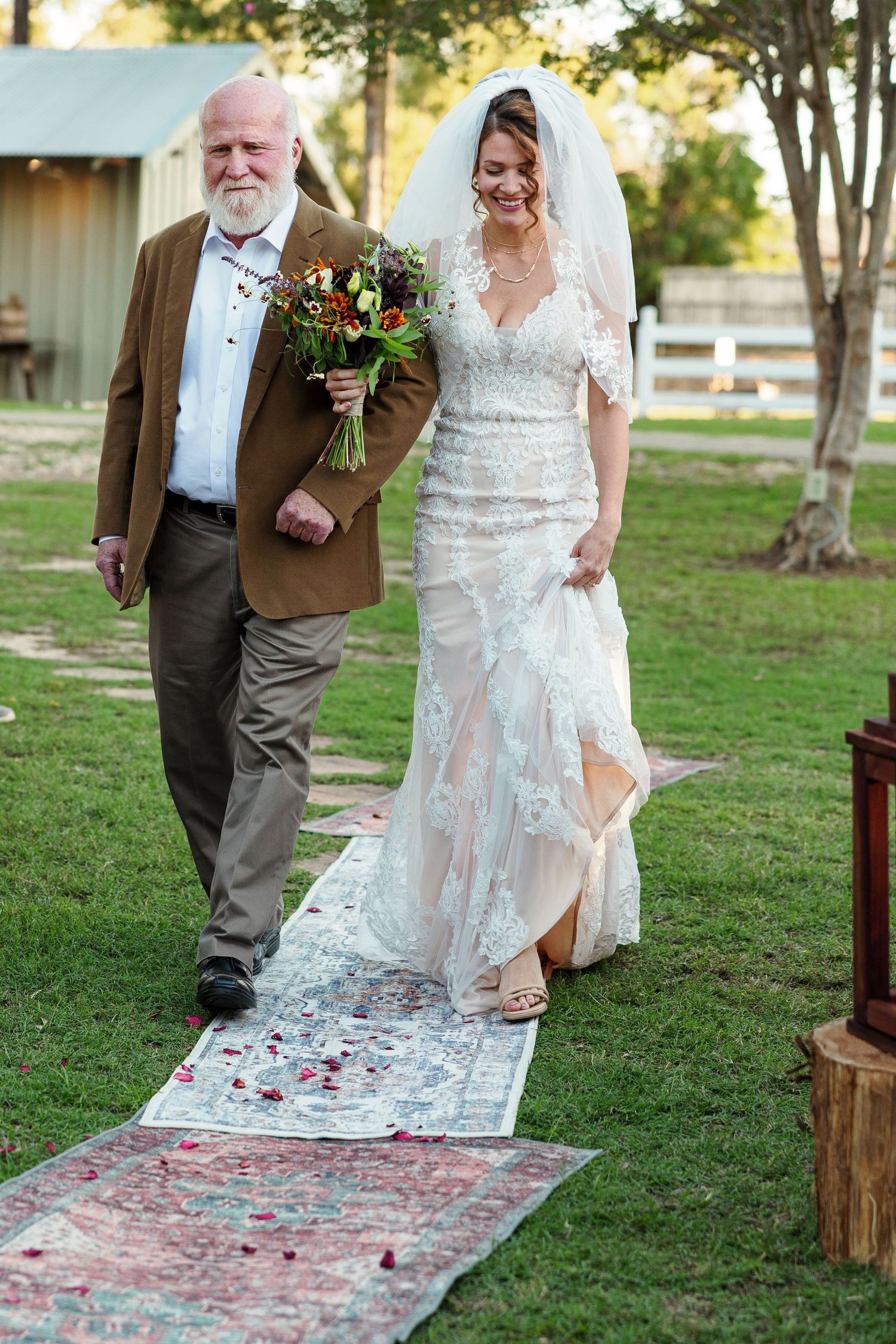 Bride's father escorts her down the aisle, photographed by Emily Joy Photography, now a wedding photographer in Memphis, TN.