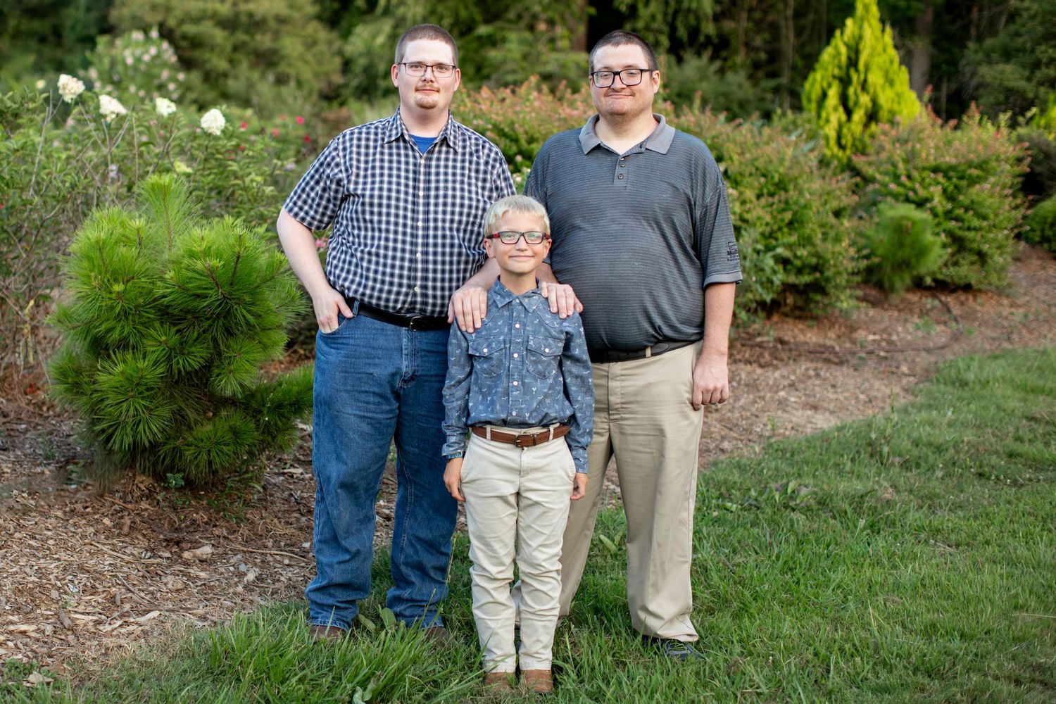 Older brothers with younger step brother in SFA's Arboretum by Nacogdoches photographer Emily Joy Photography