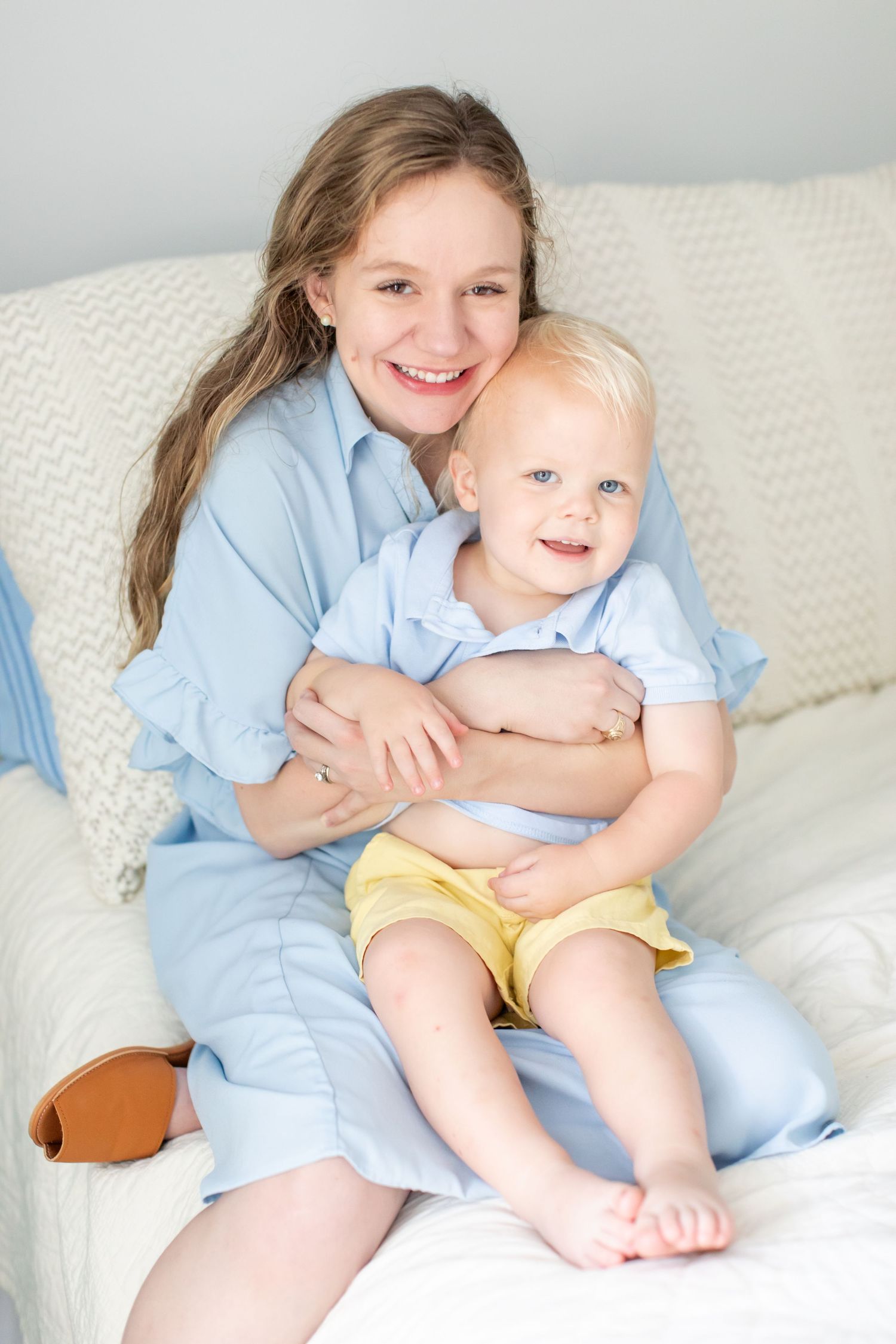 A mother snuggles her toddler boy for a portrait by Emily Joy Photography, now a wedding photographer in Memphis, TN.