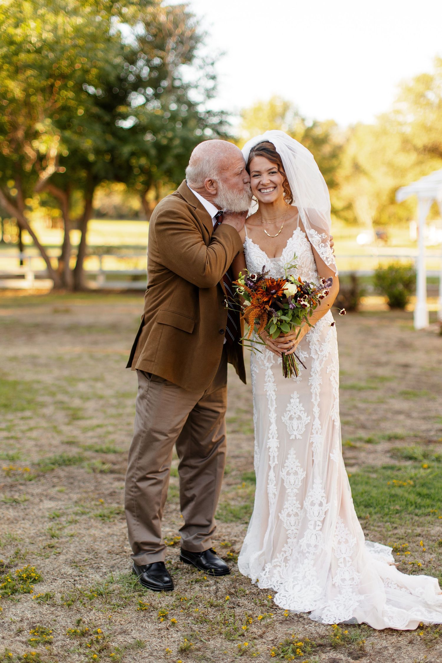 Father of the Bride giving Bride a kiss for a portrait photographed by Emily Joy Photography, now a wedding photographer in Memphis, TN.