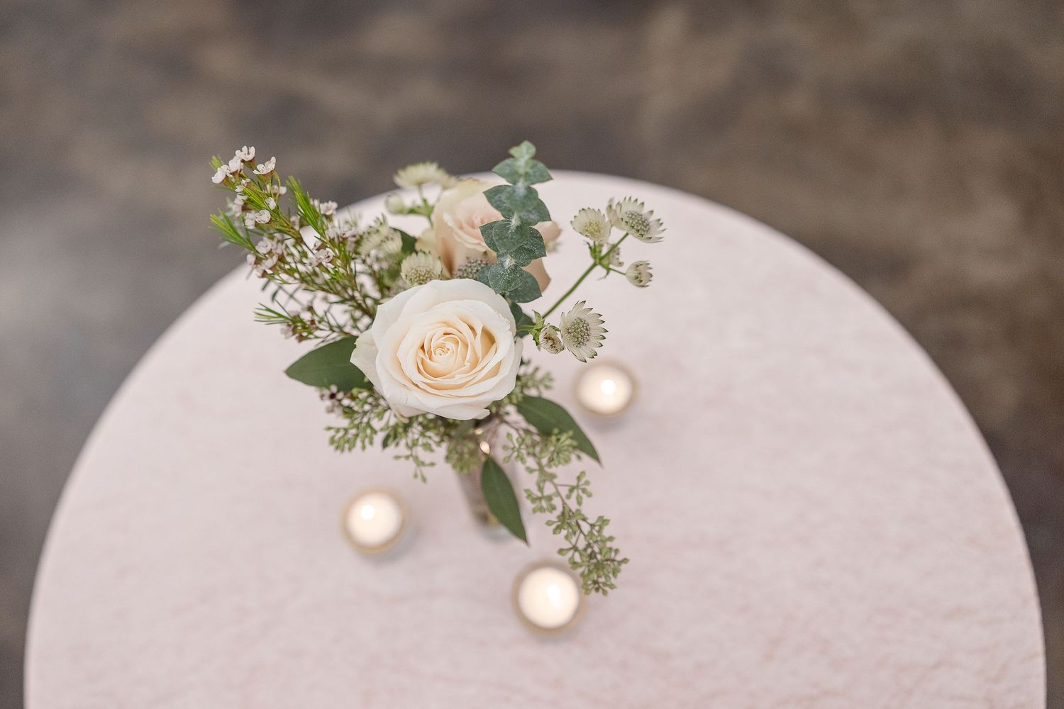 A bird's eye view of a floral centerpiece at a wedding reception. Image by Emily Joy, wedding photographer in Memphis.