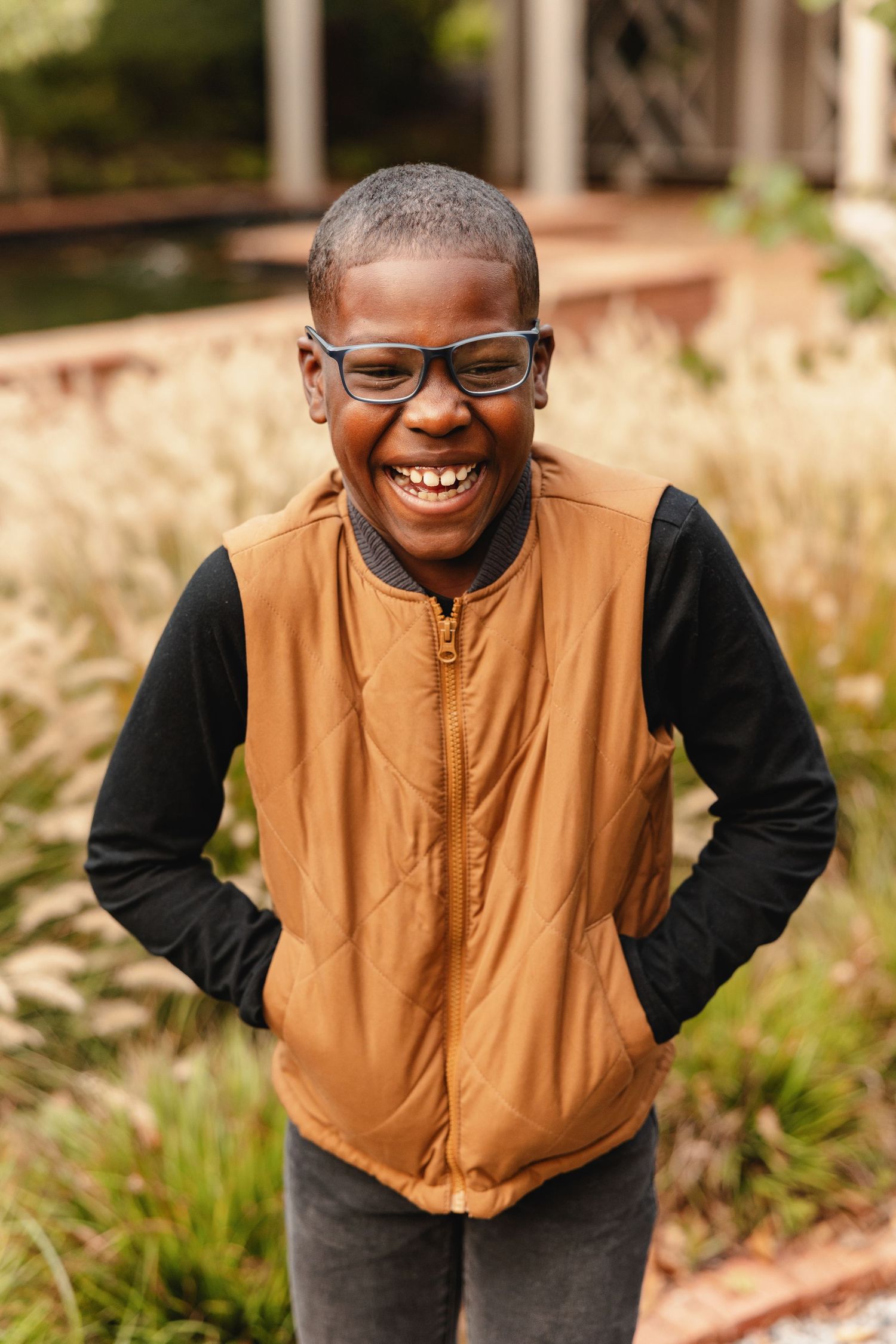 Portrait of a young boy laughing by Memphis Family Photographer Emily Joy Photography