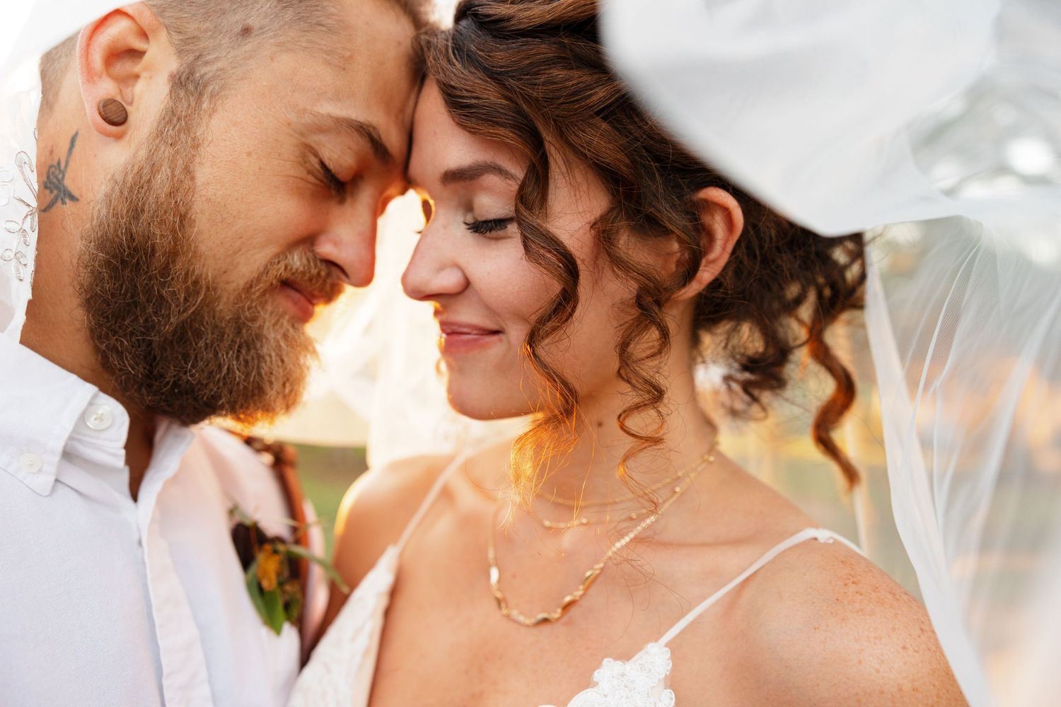 Bride and Groom basking in sunset for portrait by Nacogdoches photographer Emily Joy Photography