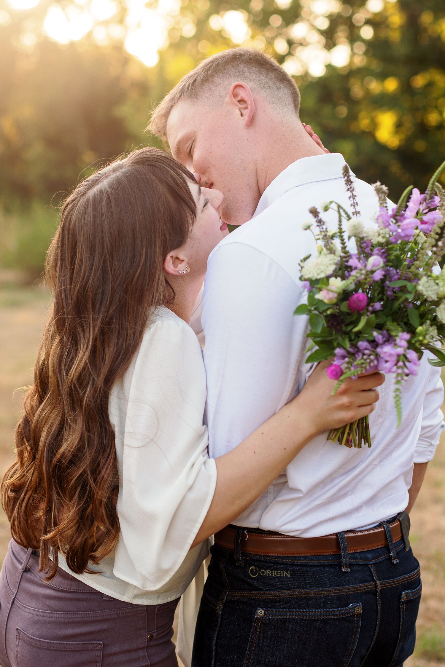Candid engagement portrait by Emily Joy Photography, now a wedding photographer in Memphis, TN.