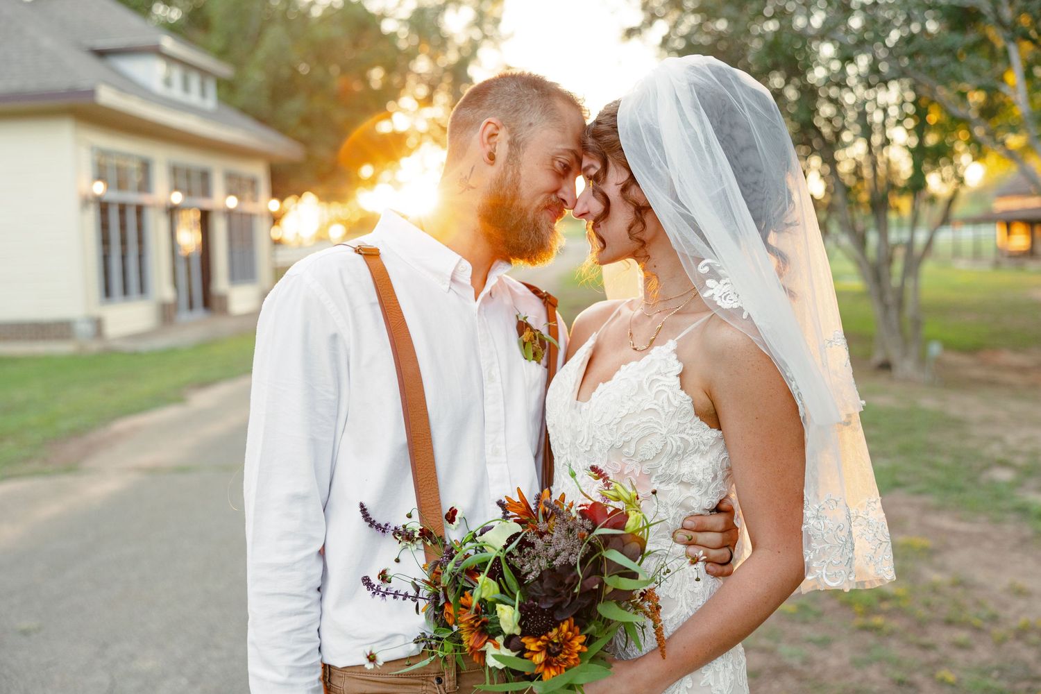 Bride and Groom basking in sunset for portrait by Nacogdoches photographer Emily Joy Photography