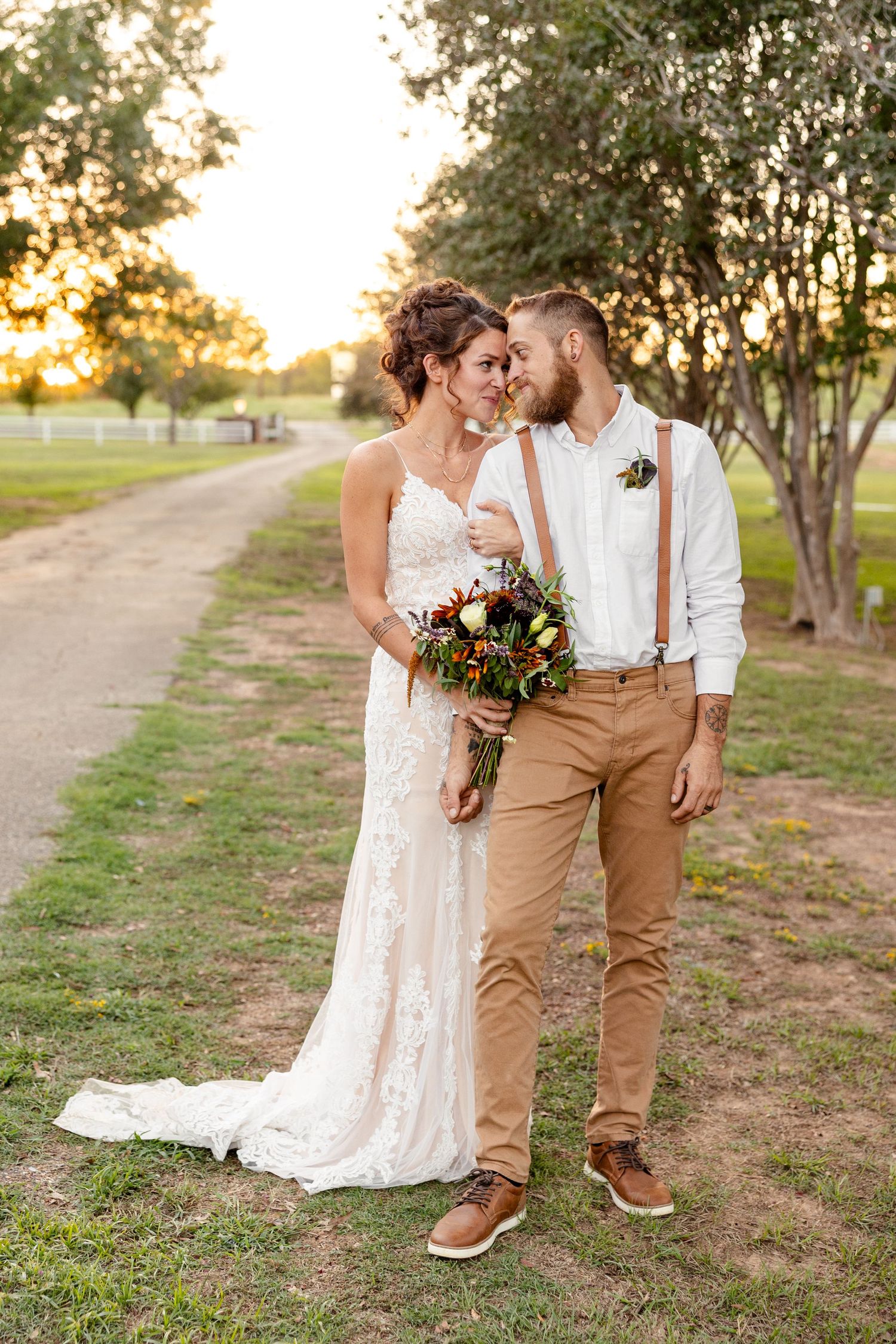 A Bride and Groom smile at each other during sunset for a portrait by Emily Joy Photography, now a wedding photographer in Memphis, TN.