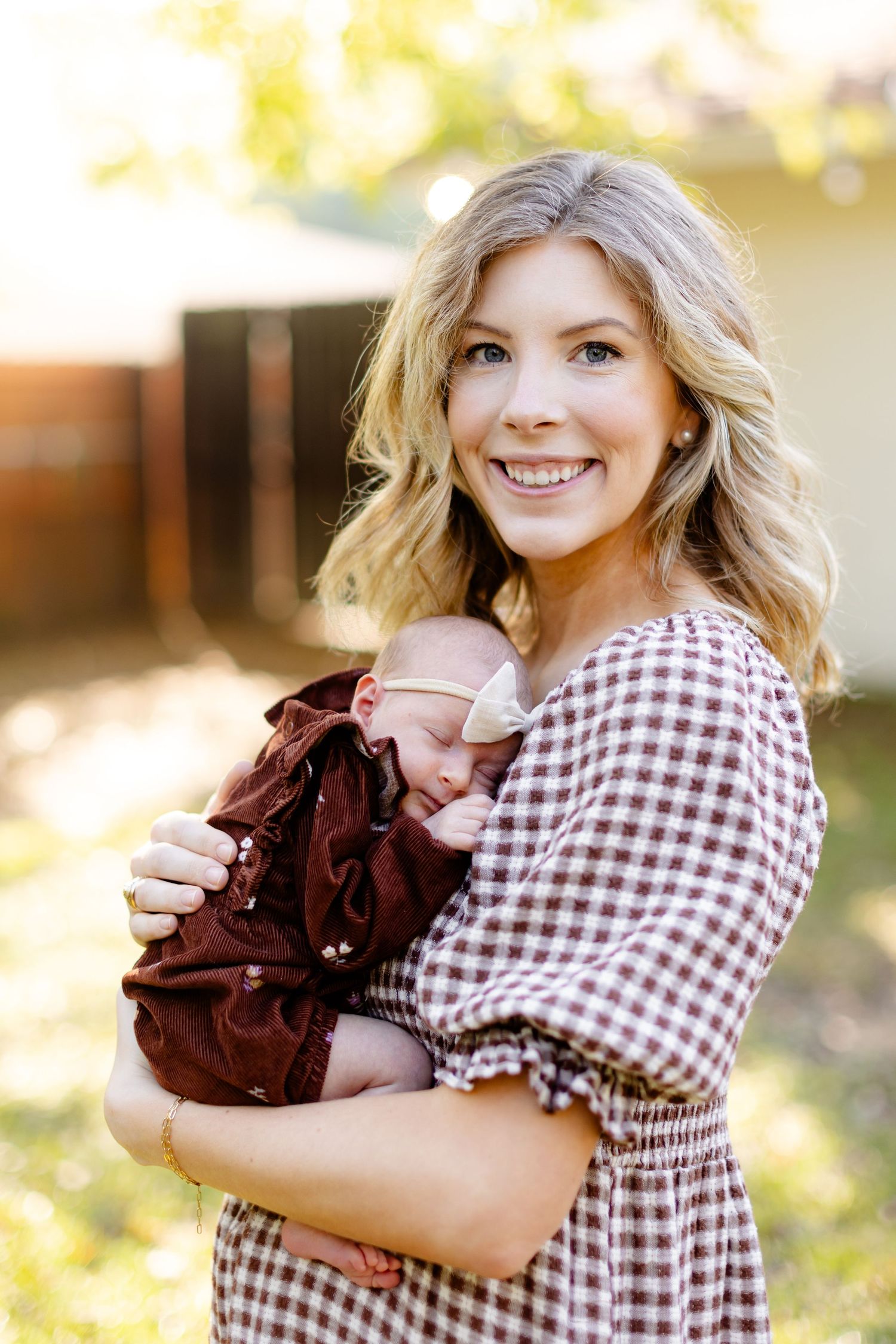 Young mother holds her baby girl for a portrait by Memphis wedding photographer Emily Joy Photography