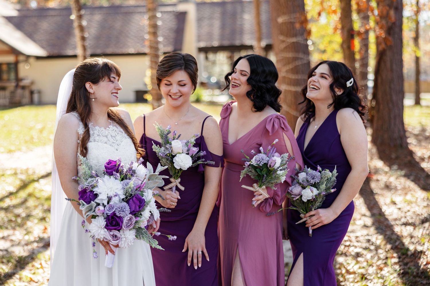 A bride, enjoying a laugh with her bridesmaids.