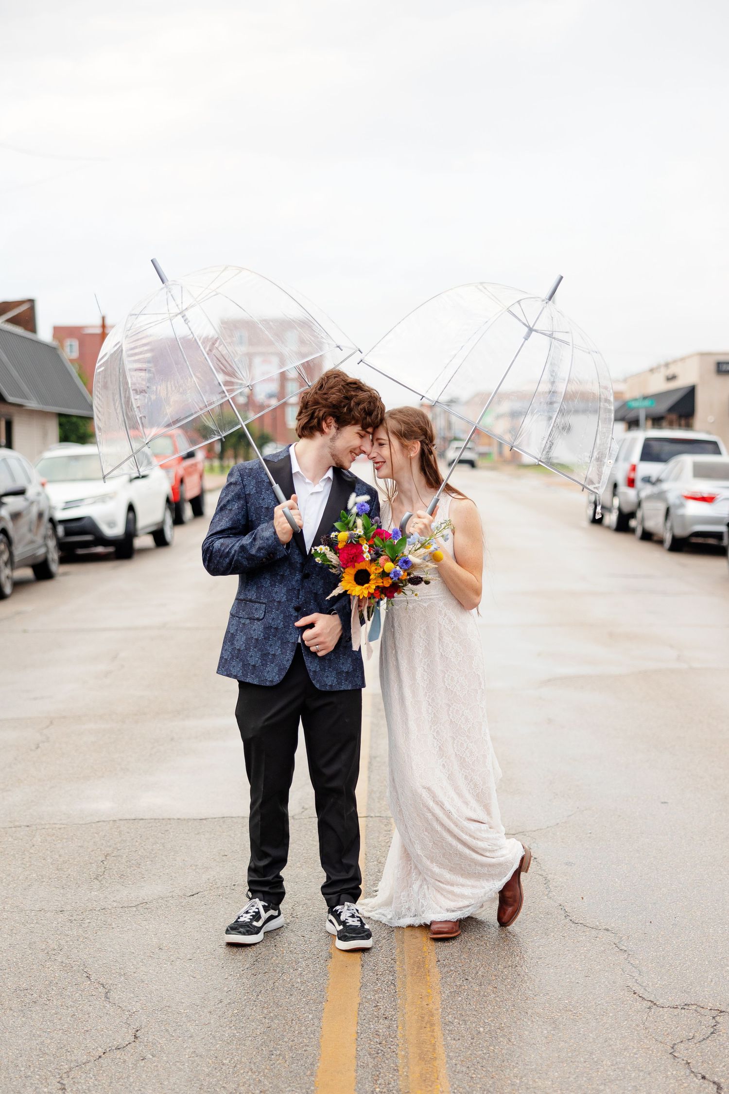 Portrait of bride and groom in the rain by Memphis wedding photographer Emily Joy Photography