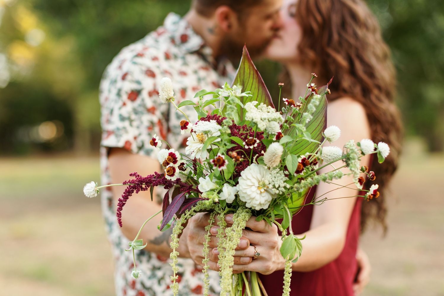 A portrait, featuring an elegant bohemian bouquet, by Emily Joy Photography, now a wedding photographer in Memphis, TN.