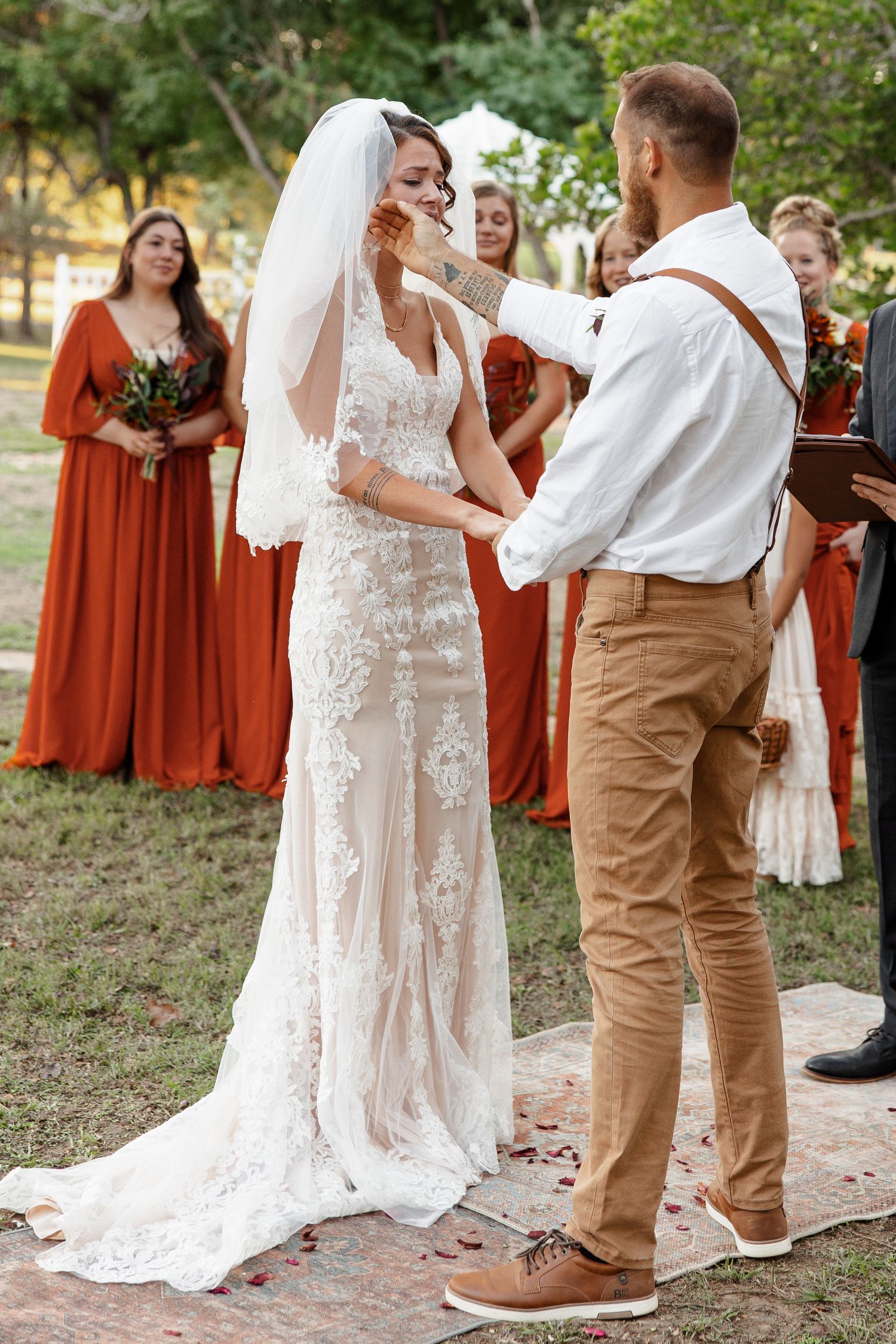 Groom wipes tear from Bride's eye during outdoor wedding photographed by Emily Joy Photography, now a wedding photographer in Memphis, TN.