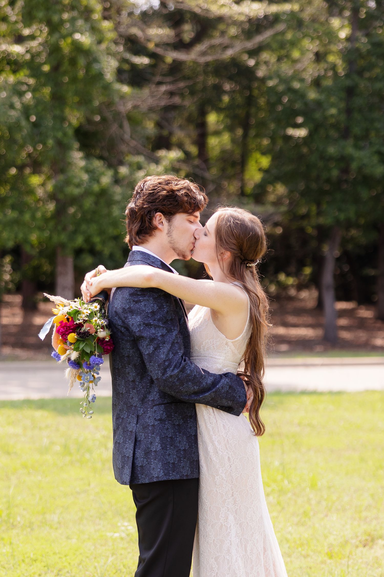 Bride and groom kiss for a portrait by Memphis wedding photographer Emily Joy Photography