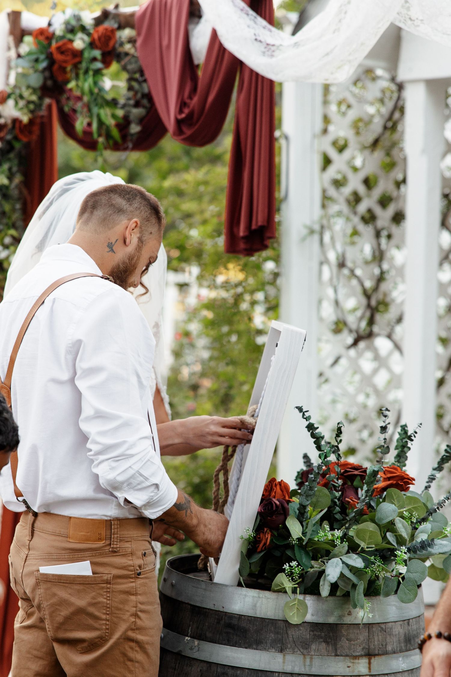 Bride and Groom tie symbolic knot during outdoor wedding photographed by Emily Joy Photography, now a wedding photographer in Memphis, TN.
