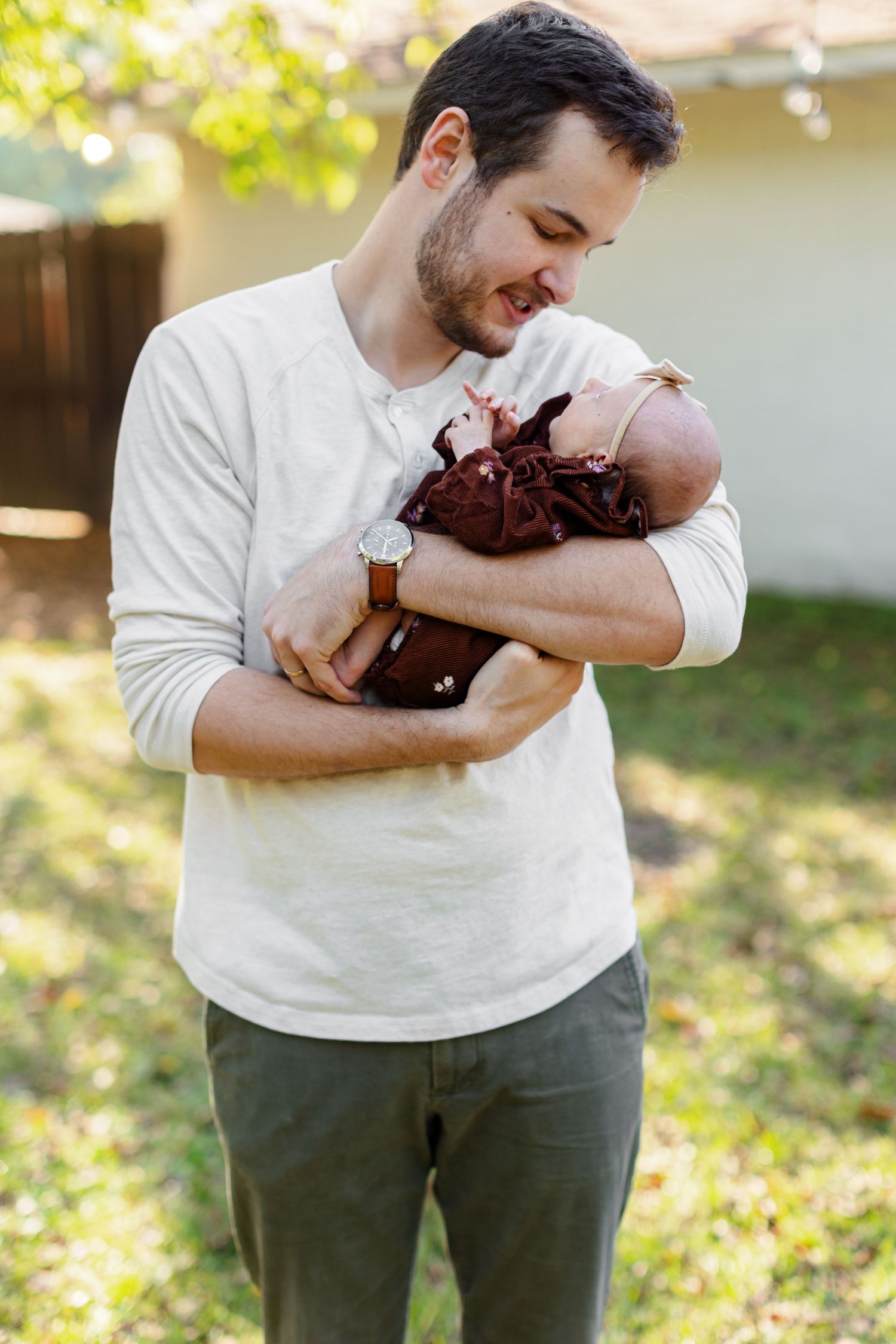 Young father holds his baby girl for a portrait by Memphis wedding  photographer Emily Joy Photography