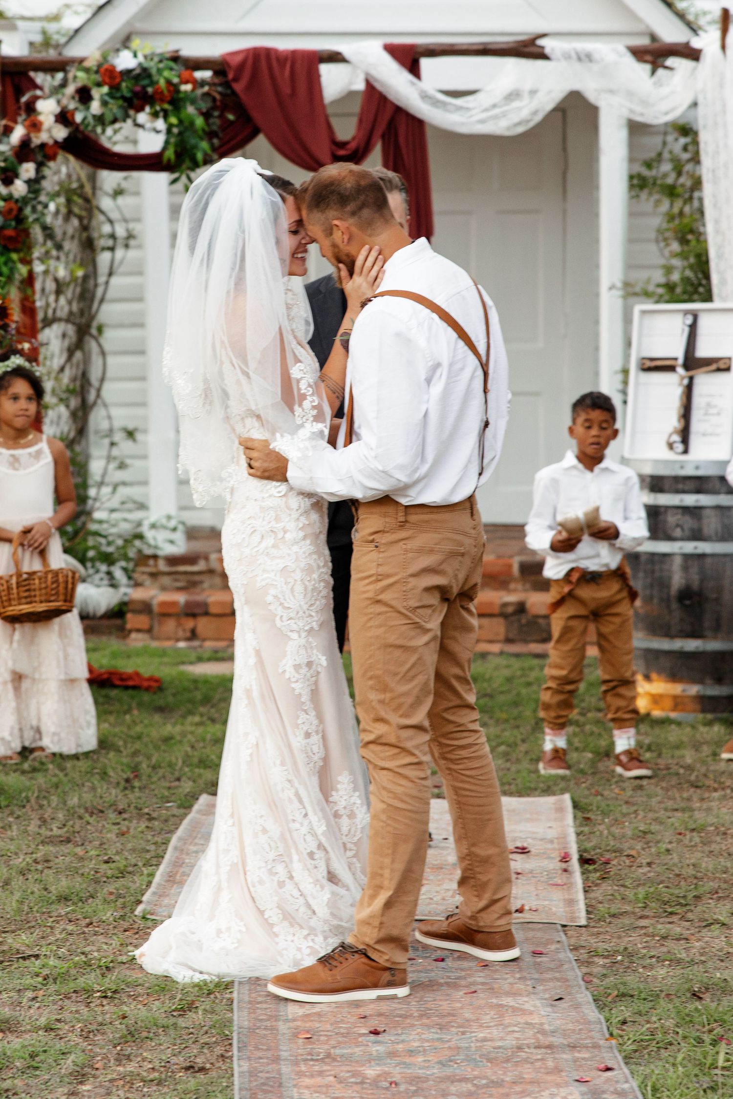 Husband and wife smile at each other after kiss for a portrait by Emily Joy Photography, now a wedding photographer in Memphis, TN.