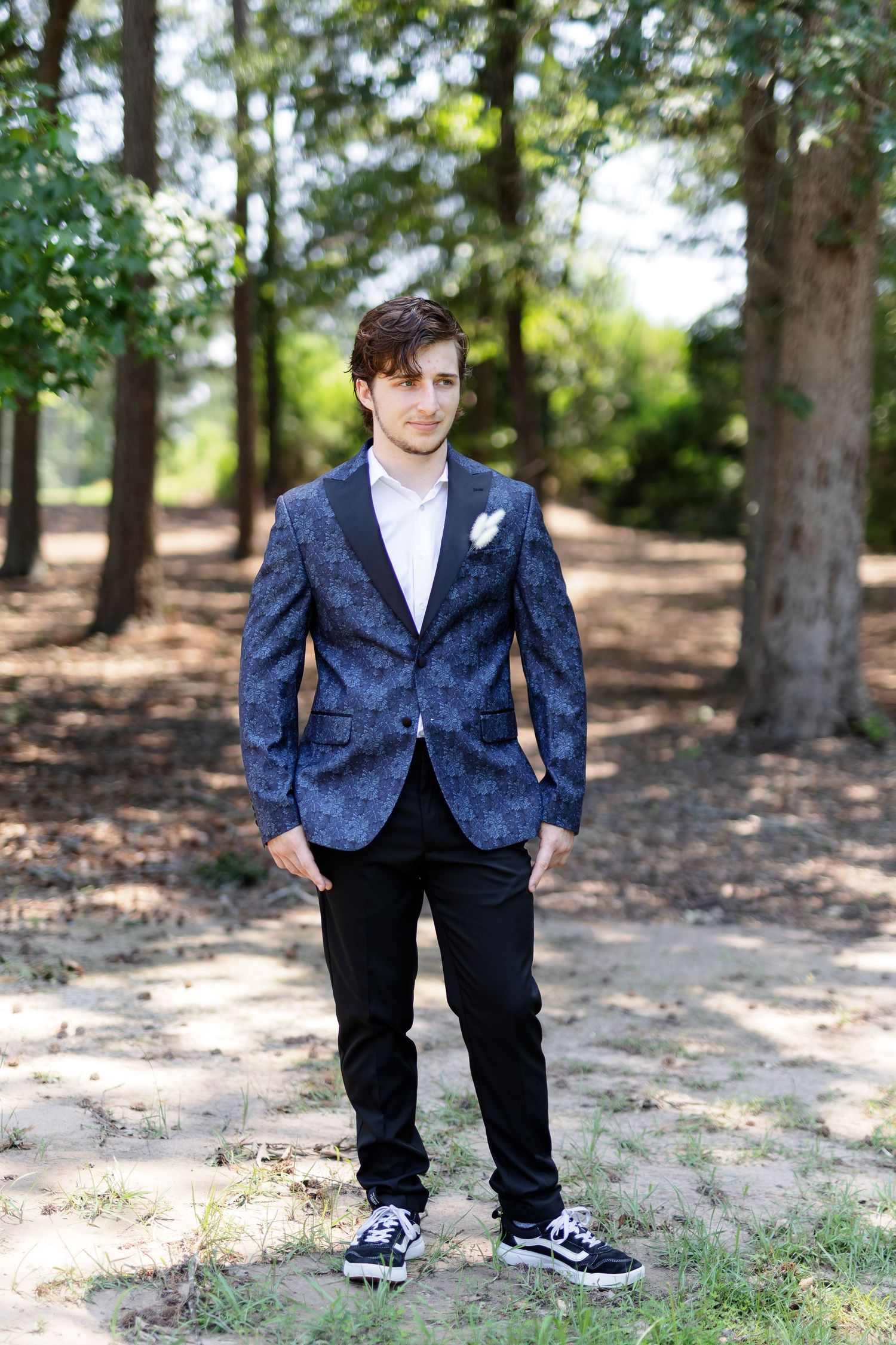 Groom poses for a portrait by Memphis wedding photographer Emily Joy Photography, second shooter Madison Grigsby