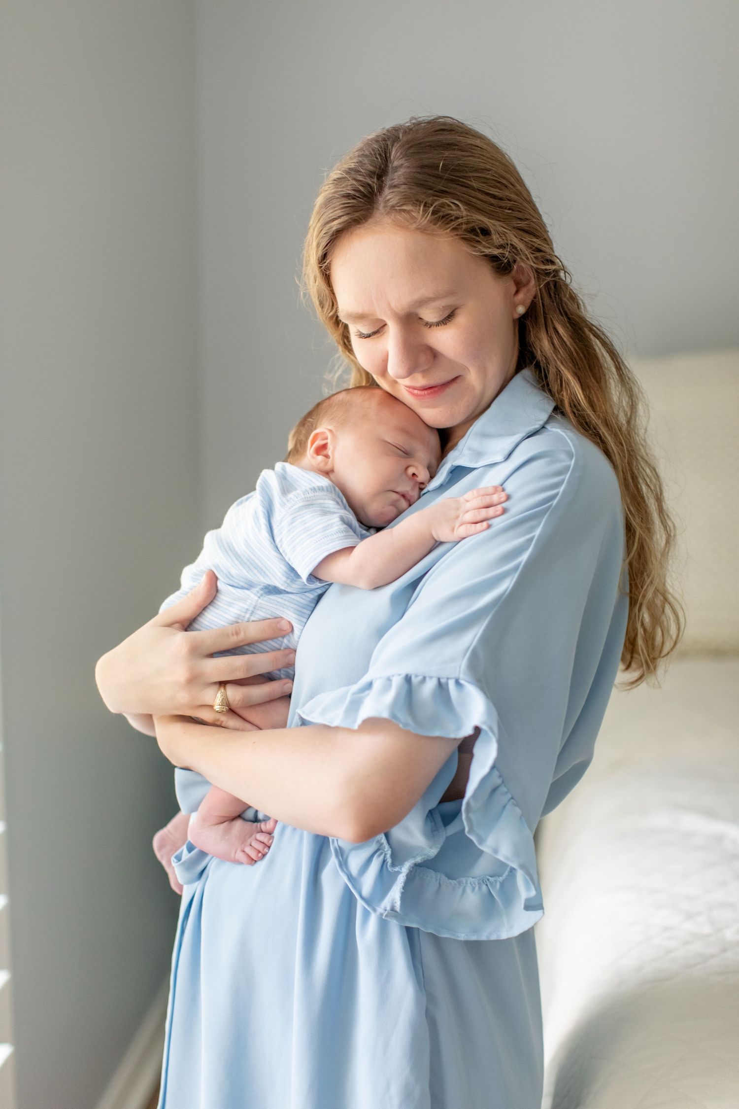 A newborn boy sleeps on his mother's chest for a portrait by Emily Joy Photography, now a wedding photographer in Memphis, TN.