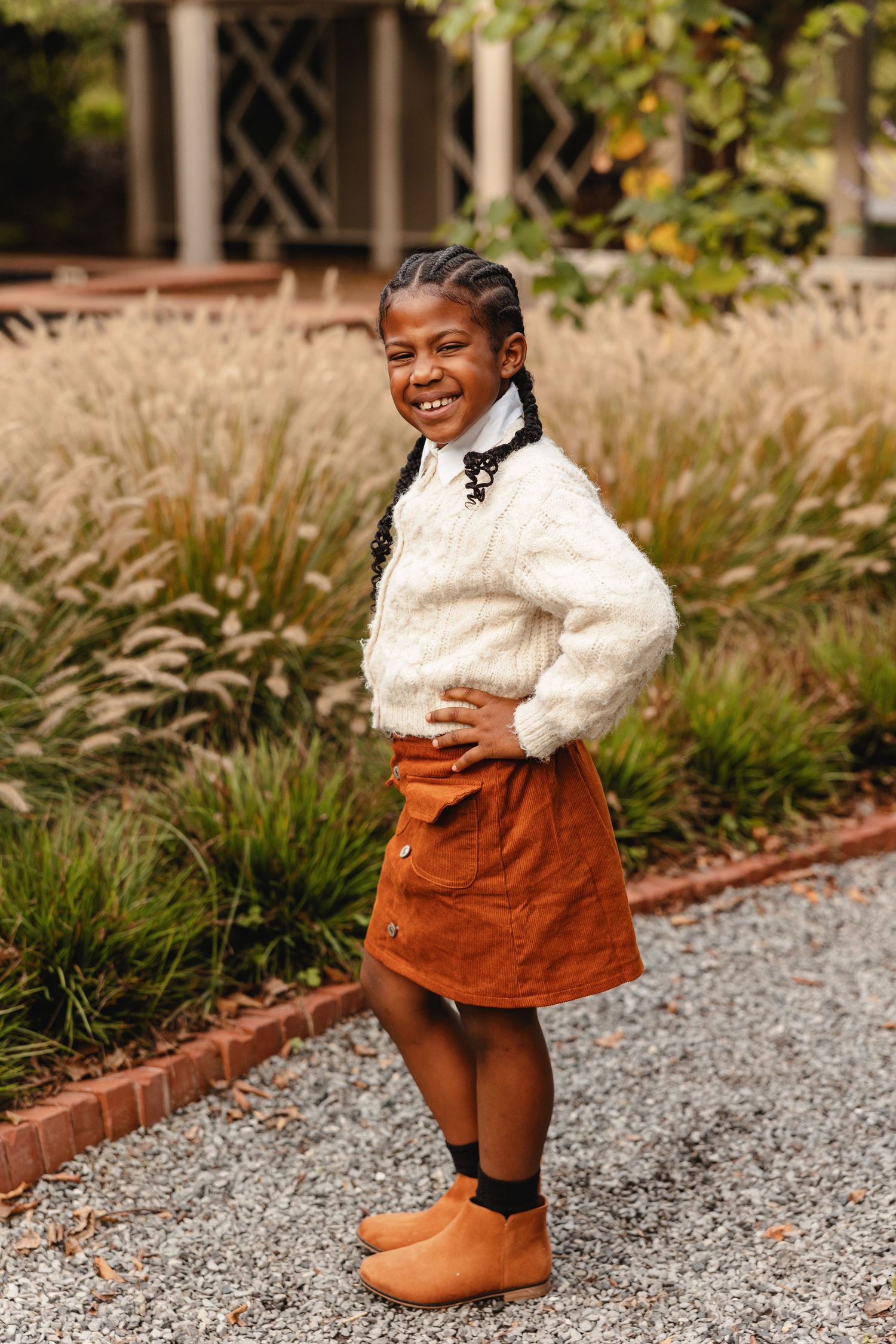 Portrait of a cute little girl posing with hand on her hip by Memphis Family Photographer Emily Joy Photography