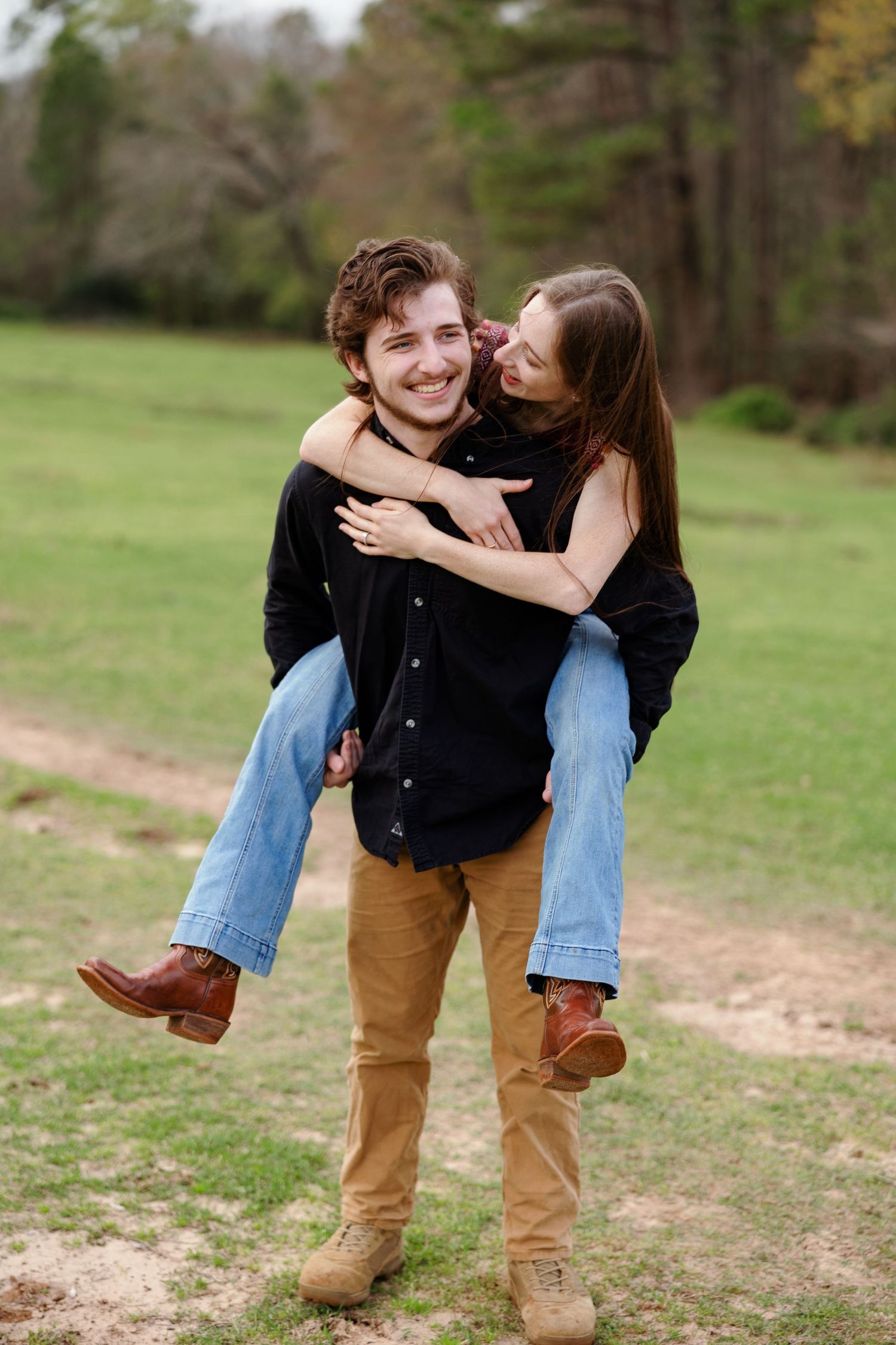 Young man laughs with his bride to be for a portrait by Memphis wedding photographer Emily Joy Photography