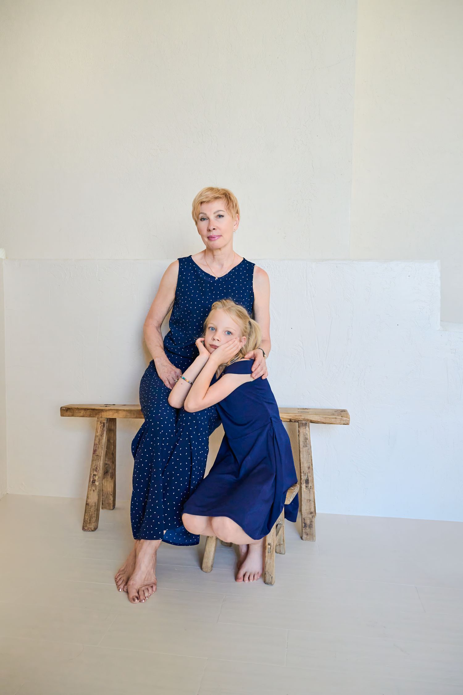 Grandmother and granddaughter sitting together during a Toronto family photography session.