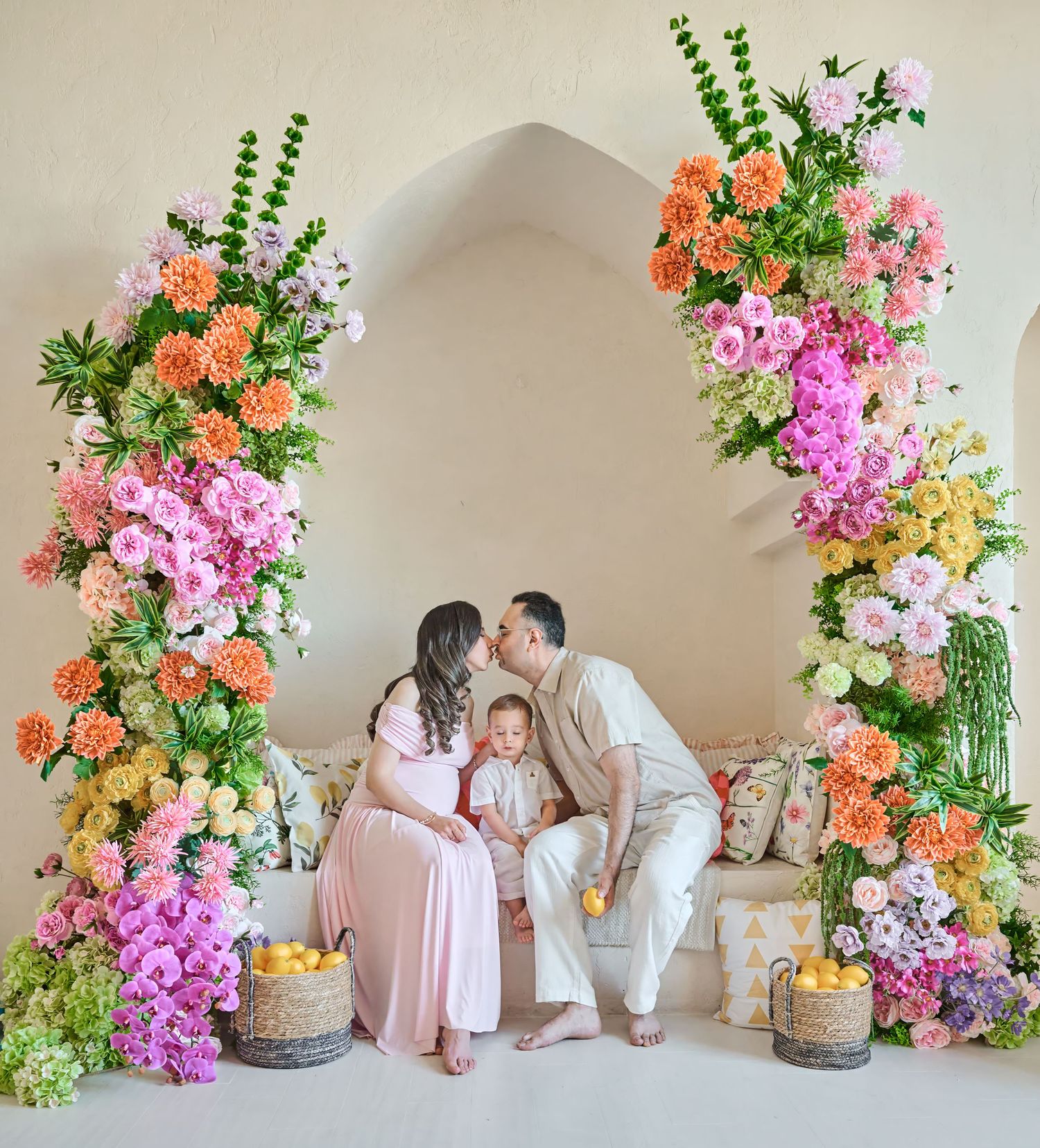 Expecting parents and their child photographed together during a Toronto maternity family photography session.