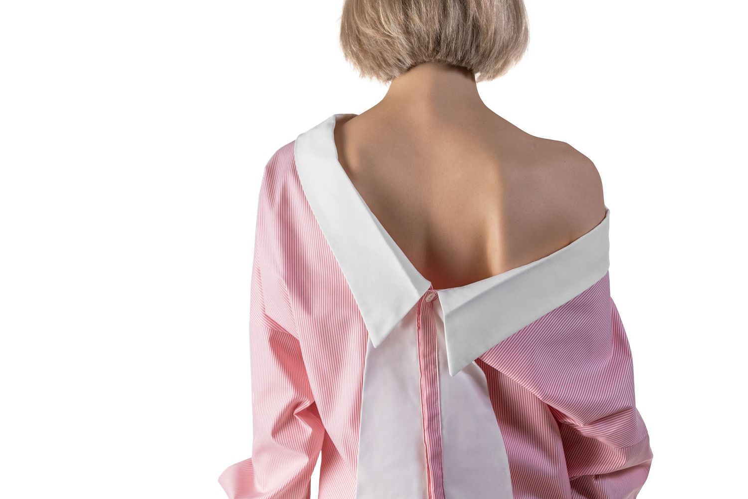Pink and white clothing details shown in closeup.