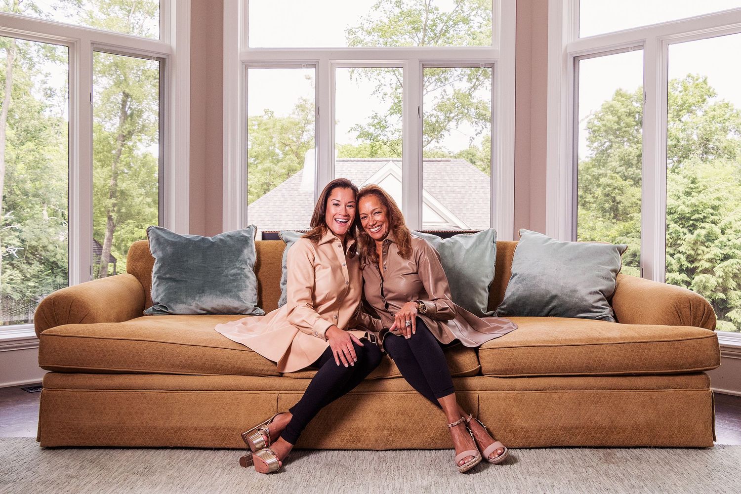 Lifestyle photos showing relaxed poses on a brown leather couch in sunny room.