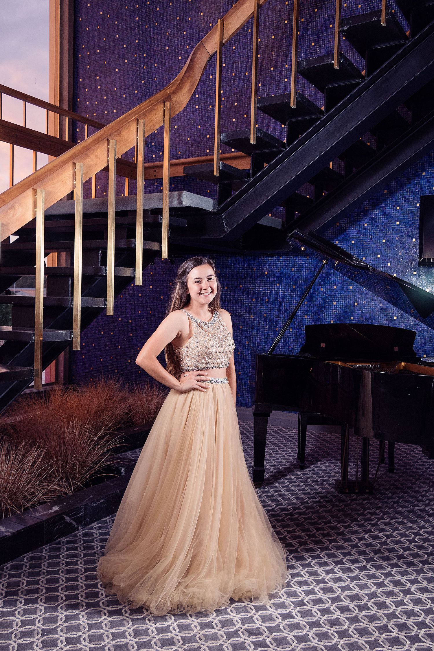 Champagne colored tulle ballgown showcased in glamorous evening photoshoot.