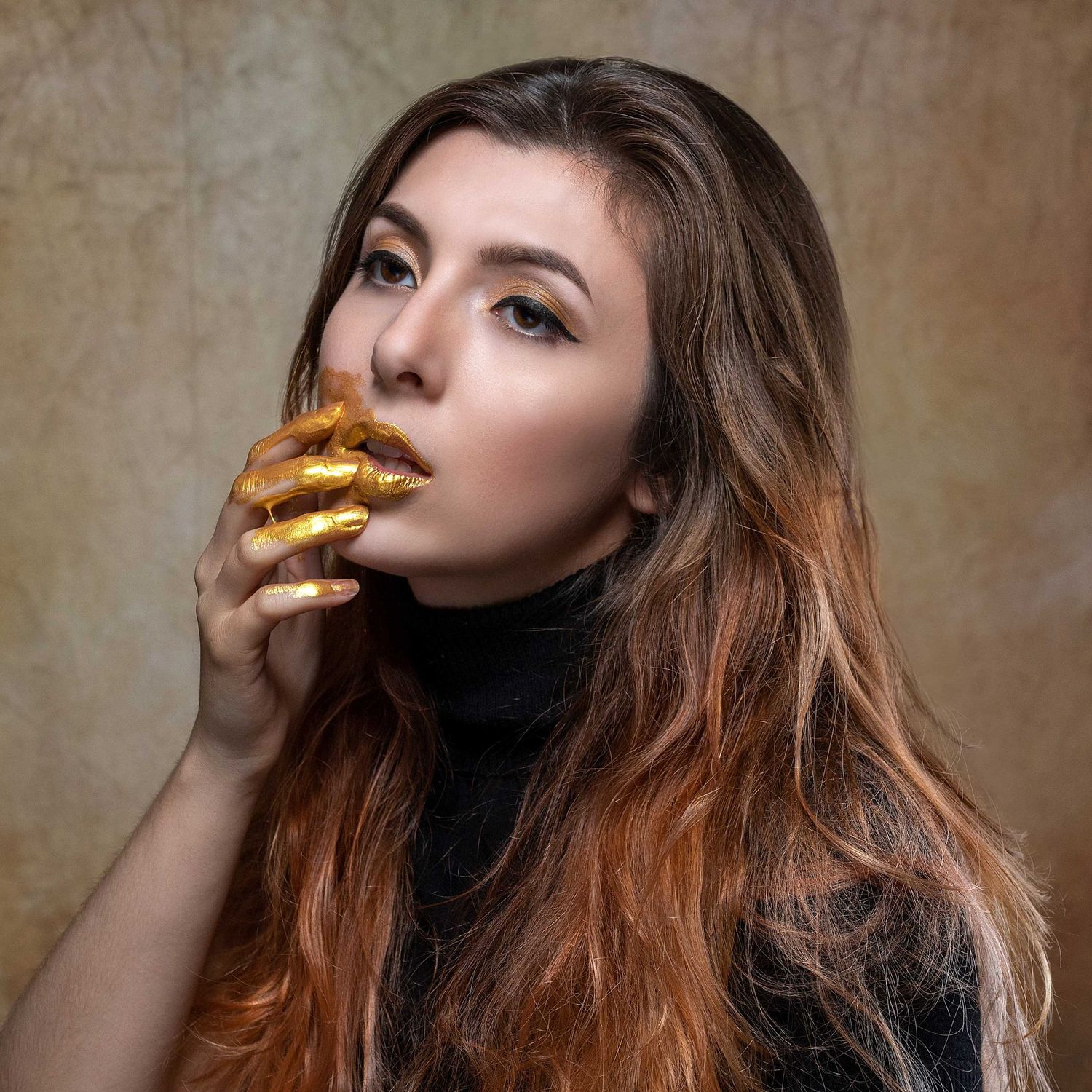 Artistic portrait series with gold-painted fingers against a neutral background.