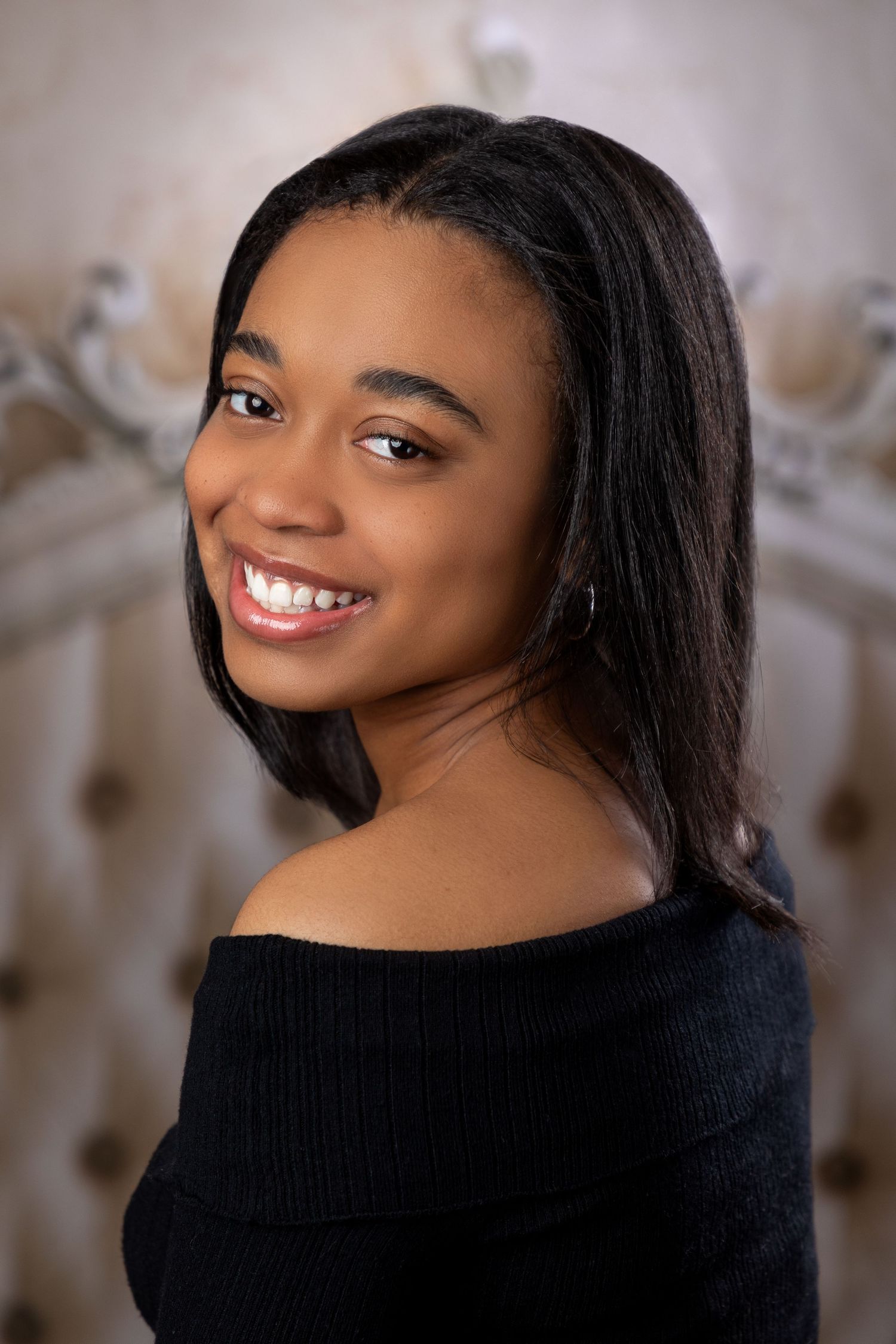 Studio portrait sequence featuring someone in a black sweater with soft lighting and neutral background.