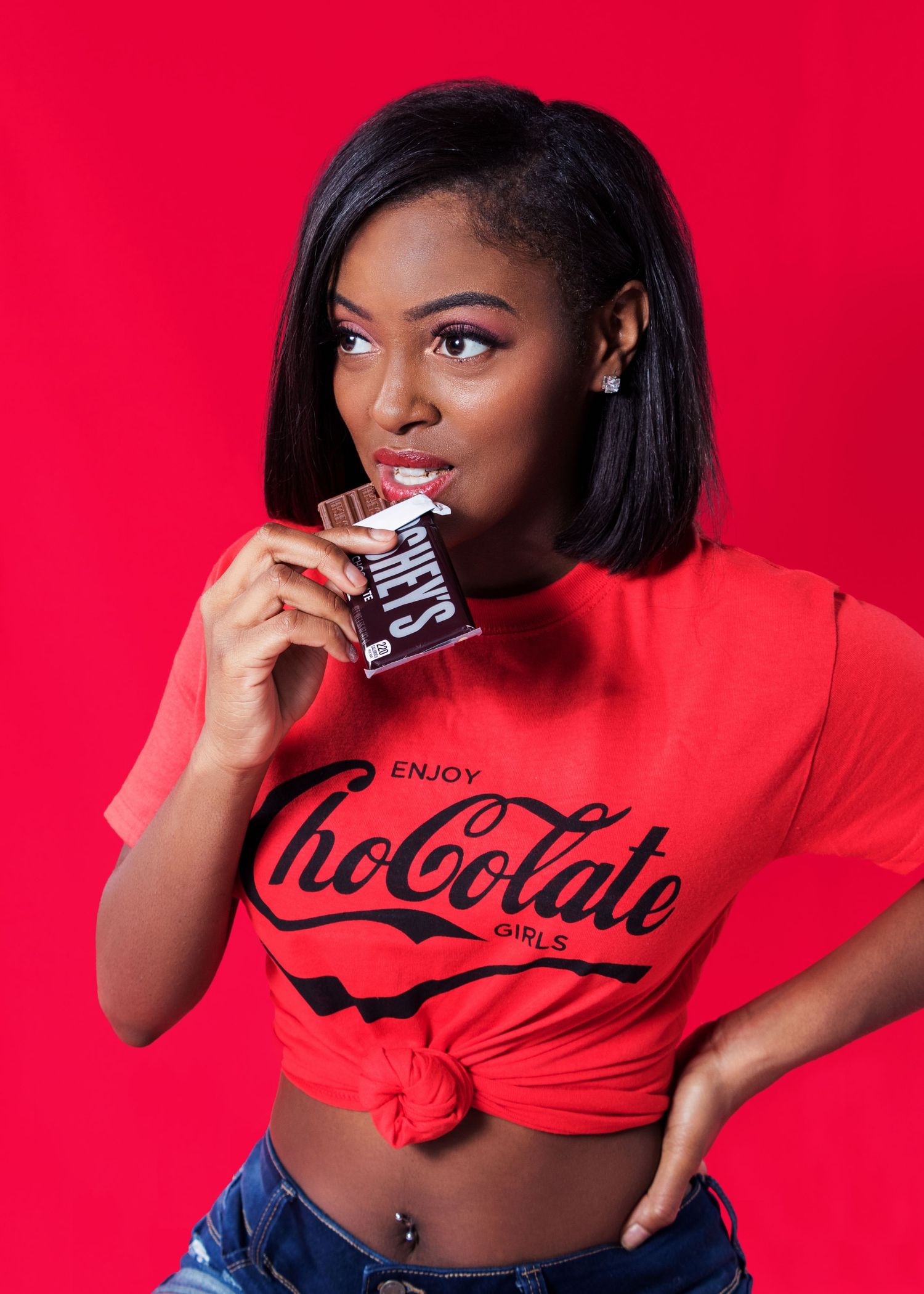 Red themed fashion photography setup against vibrant background.