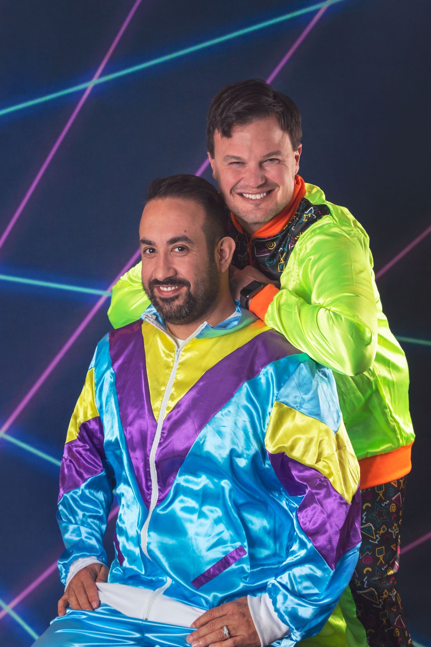 Retro style photo with neon windbreakers against geometric background.