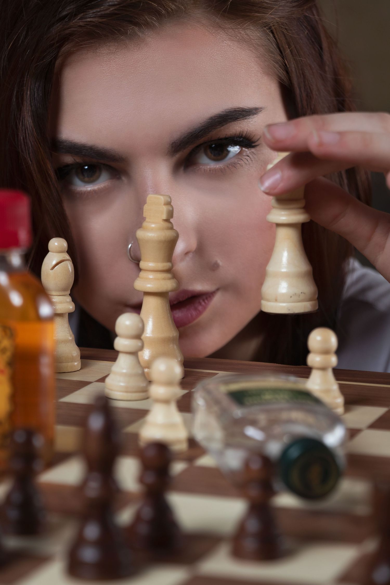 Close-up chess-themed portrait series focusing on strategic game pieces and intense expressions.
