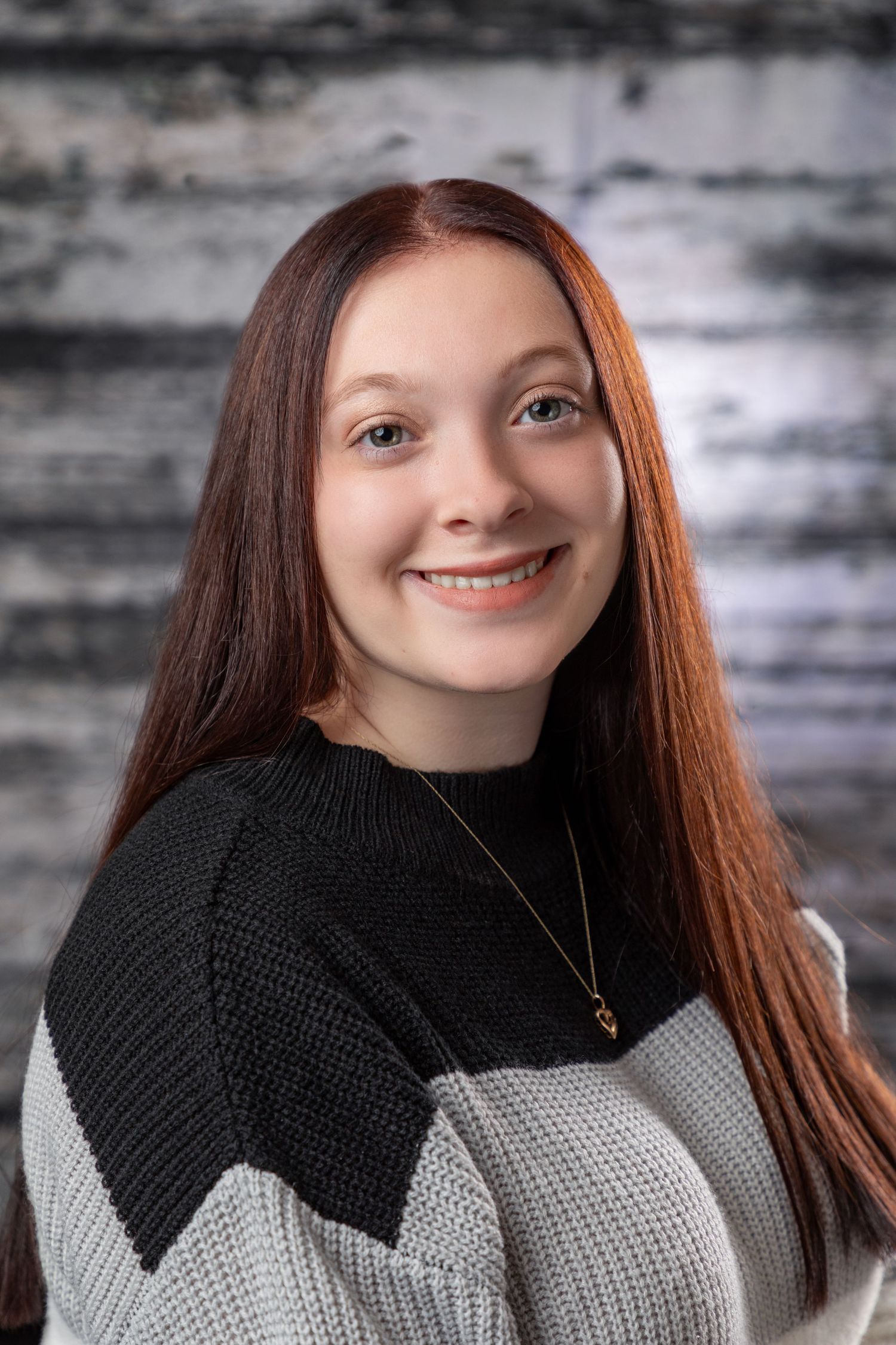 Professional portrait series showing a person in a black and white sweater against a textured background.