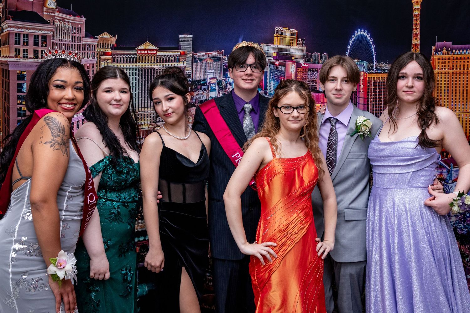 Group photo of people in formal dresses at Las Vegas event.