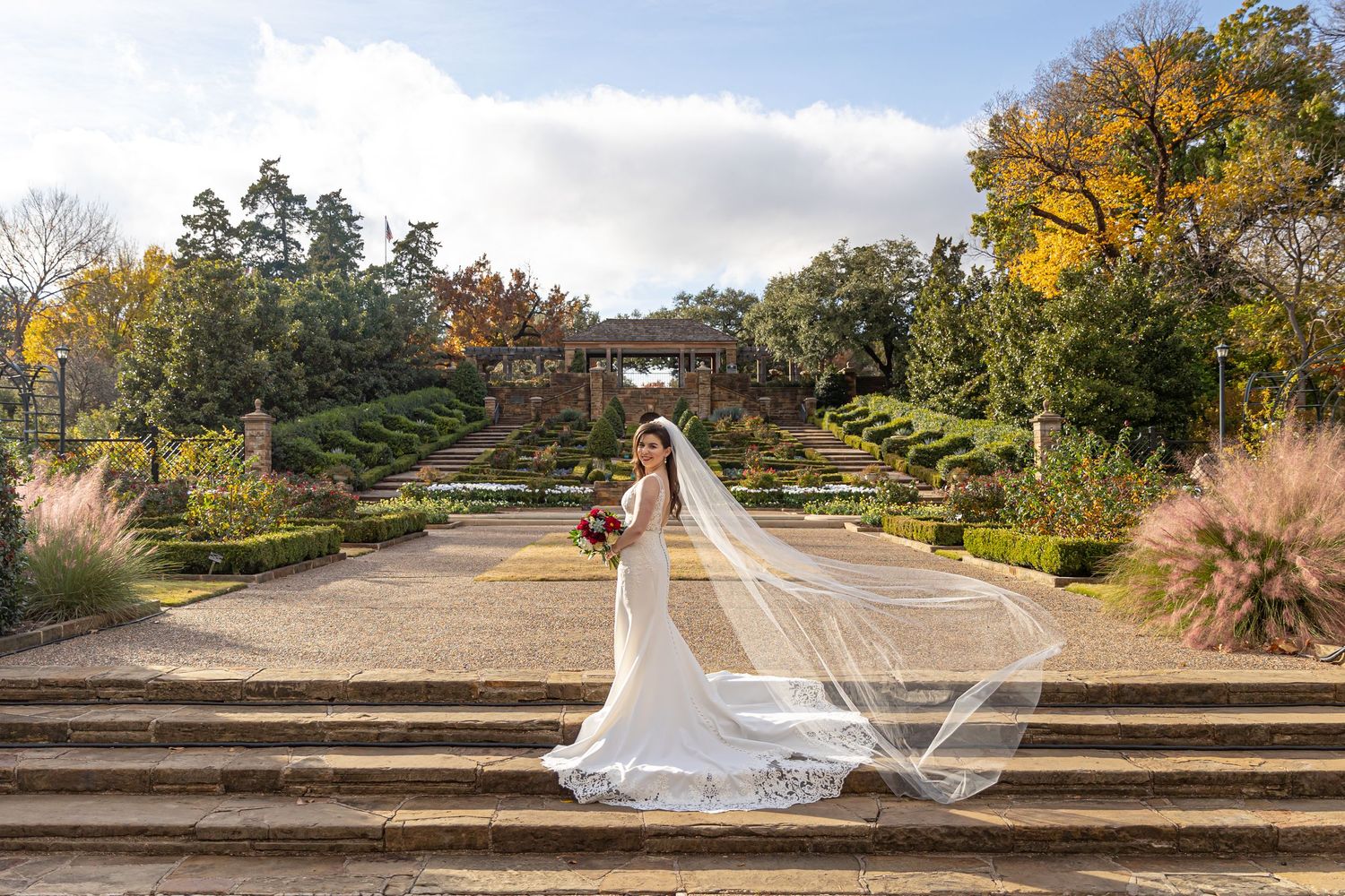 bride on the lawn of the fort worth botanical gardens in autumn in fall Texas