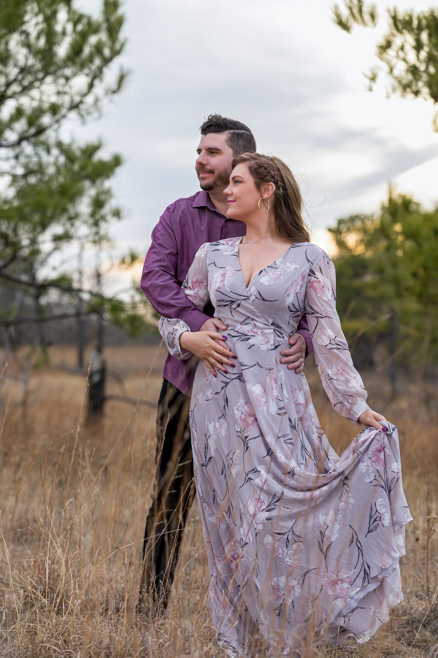 engaged couple in autumn wearing purple