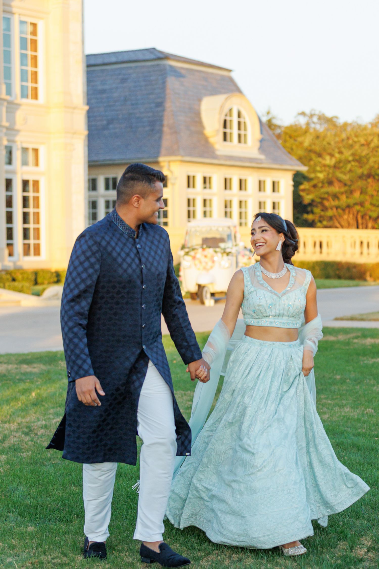 Bride and groom candid moment in a portrait session on the lawn of The Olana wedding venue
