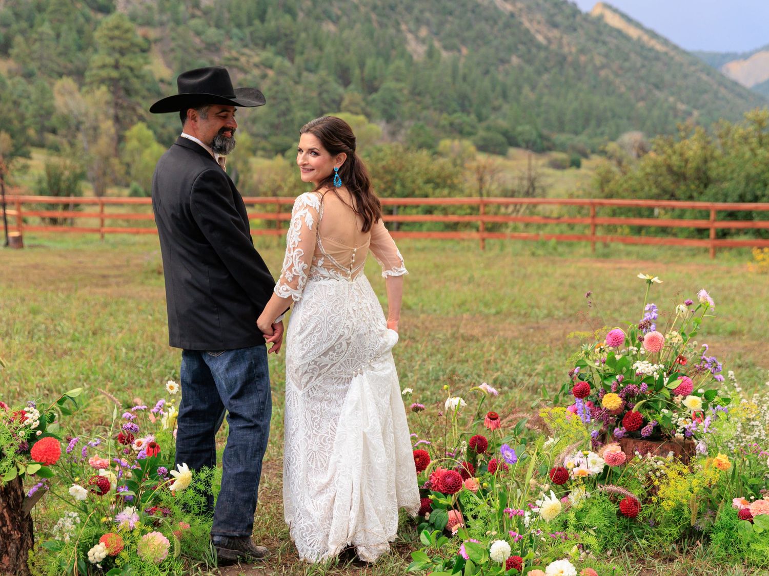 bride and groom in the mountains of Durango Colorado surrounded by wild flowers