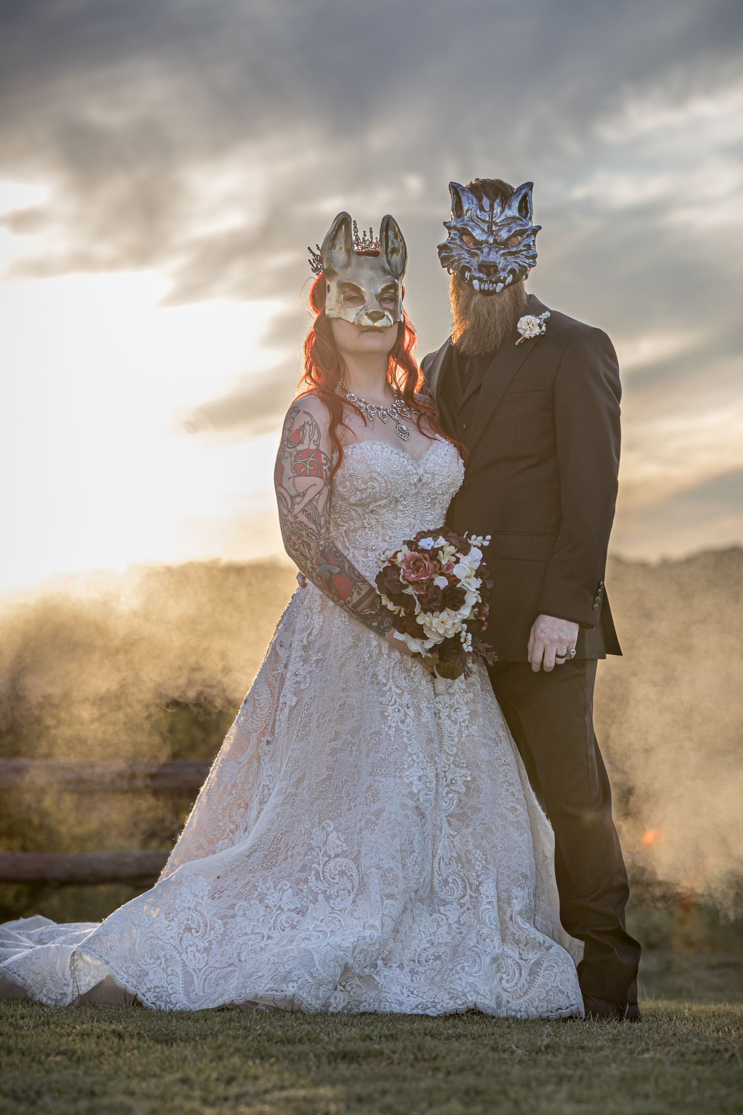 bride and groom on halloween wedding at sunset wearing masks