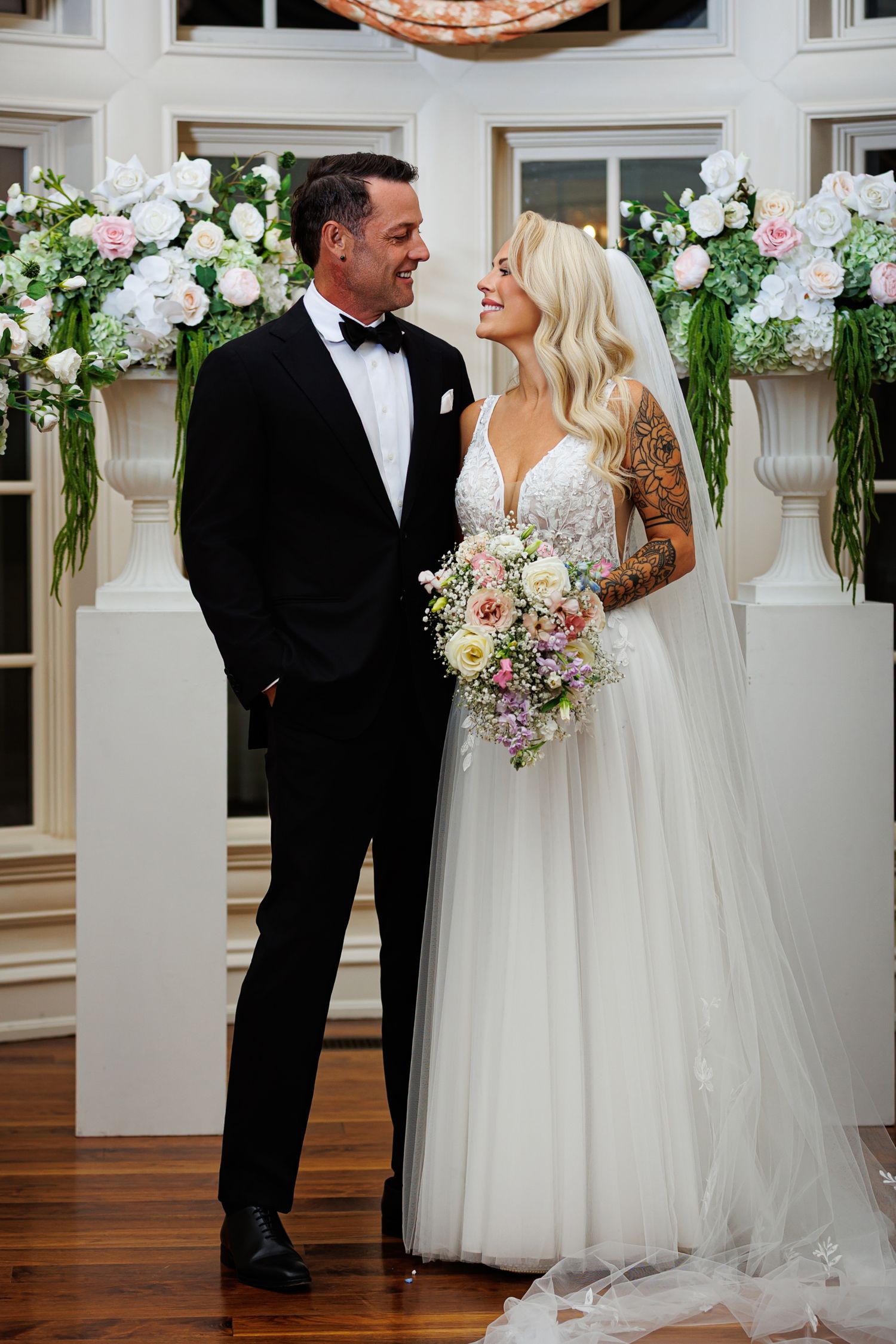bride and groom at the alter in the garden room of The Olana Walters Wedding Venue