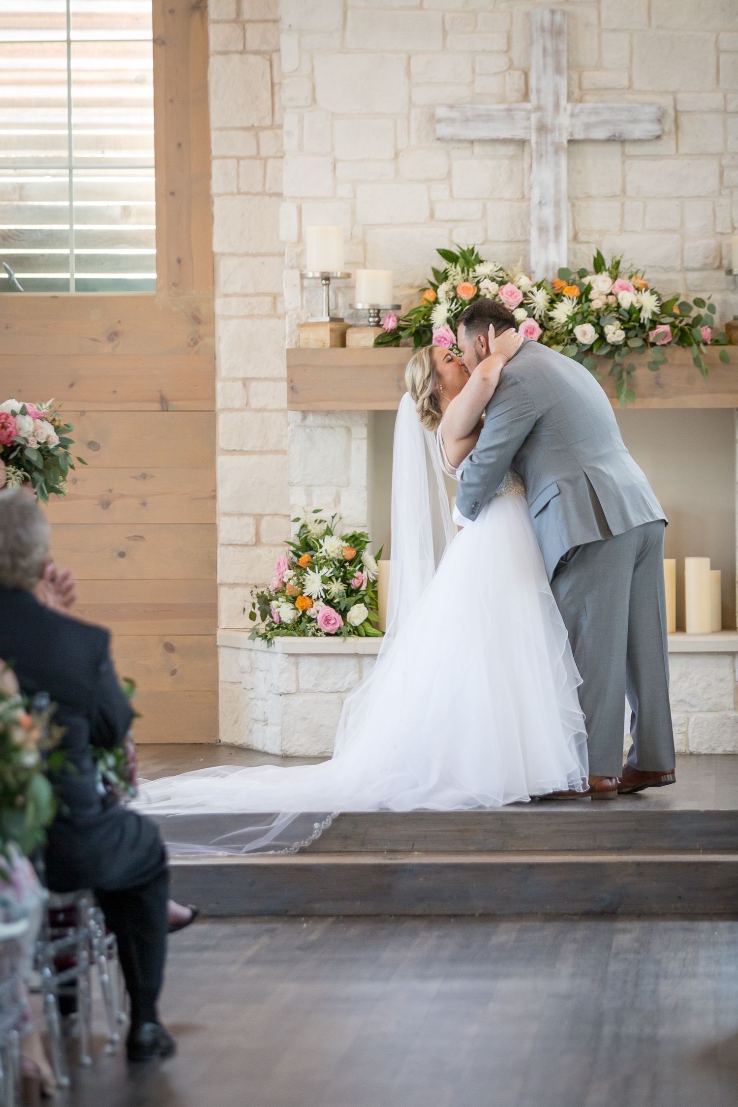 bride and groom kissing at alter at Walters wedding venue