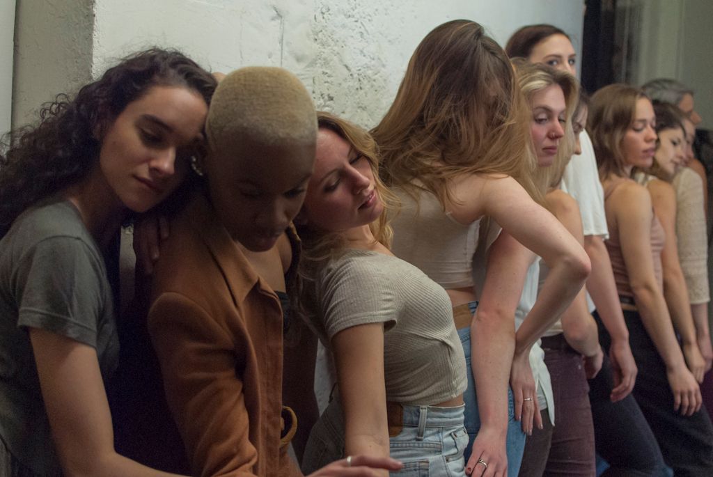 Group portrait of dancers posing in a renovated industrial studio space in Hartford, Connecticut