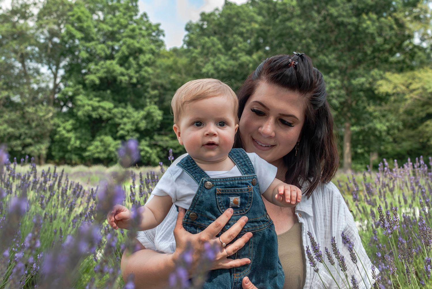 Family lifestyle portrait of mother and young child in a lavender field located in Connecticut