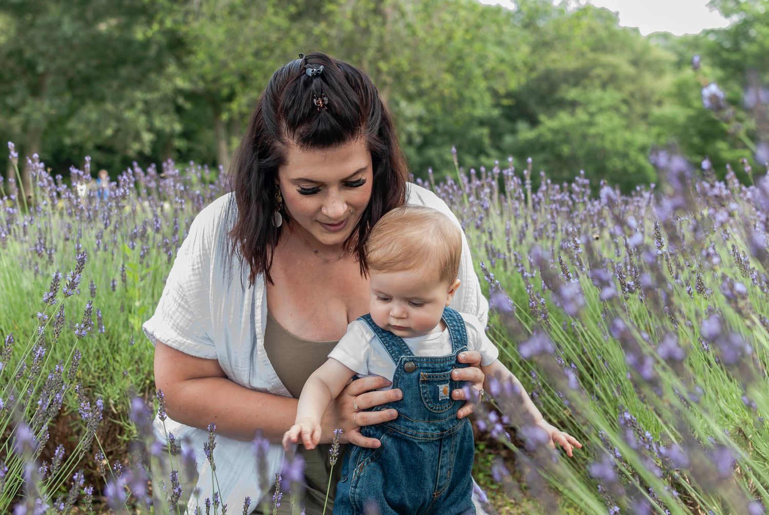 Family lifestyle portrait of mother and young child in a lavender field located in Connecticut