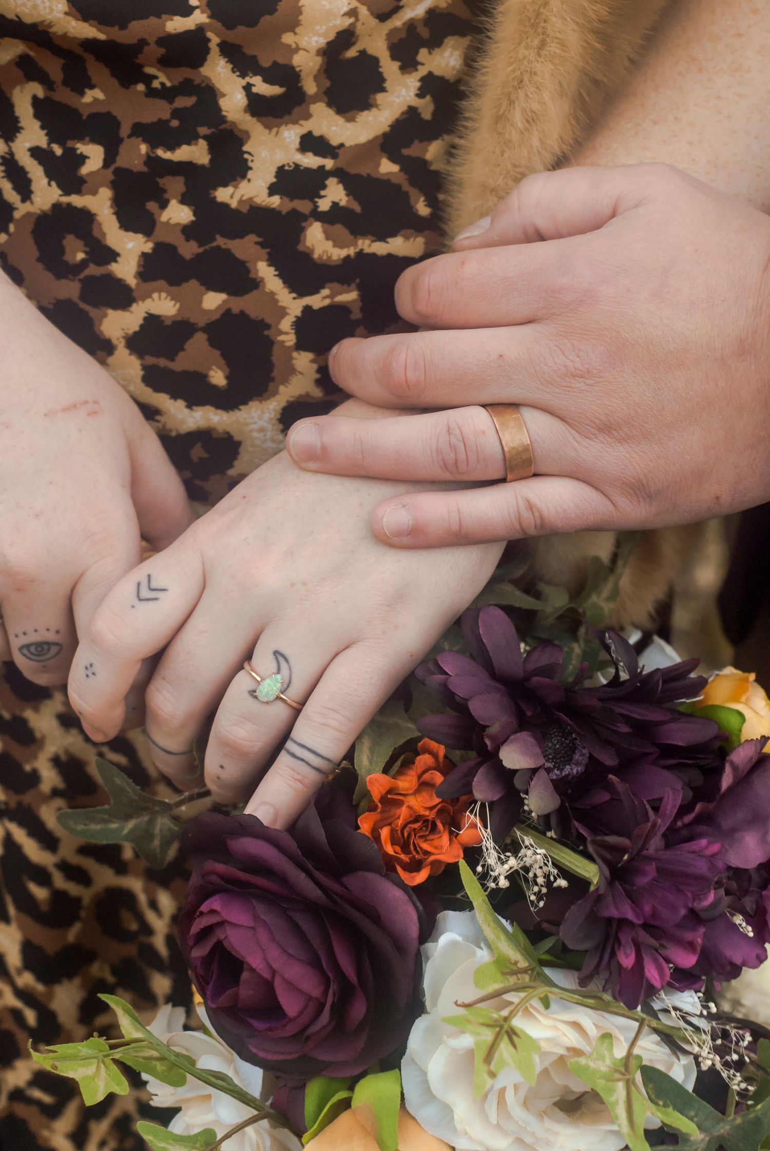Close-up detail of a bride and groom’s hands showing wedding rings during an elopement in the Catskills, NY