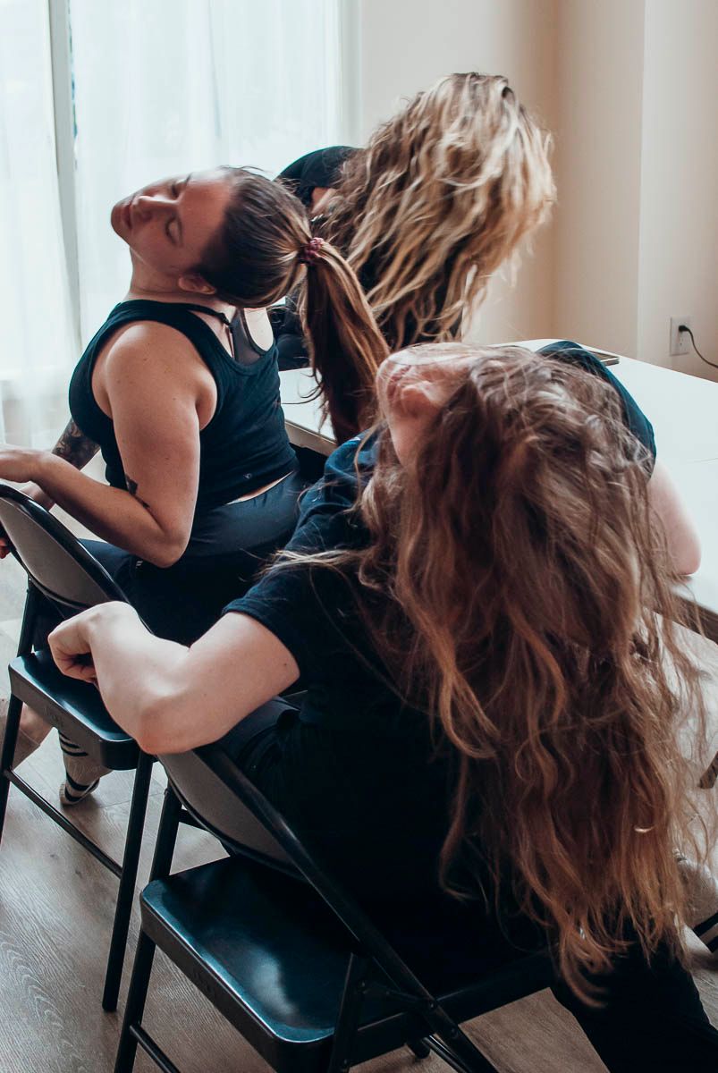 Dancers rehearsing a contemporary routine in a dance studio